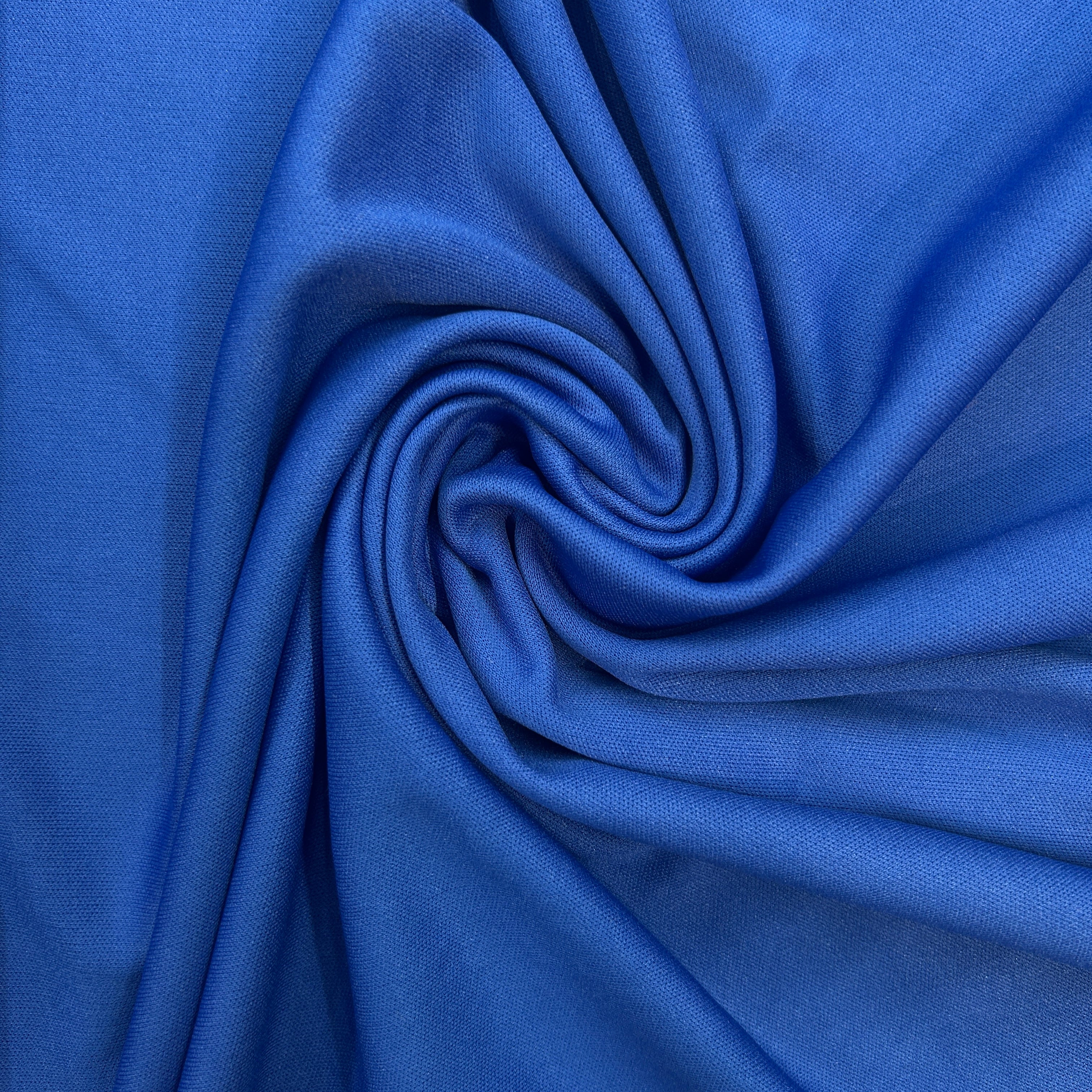 Close-up of blue fabric with a swirl pattern