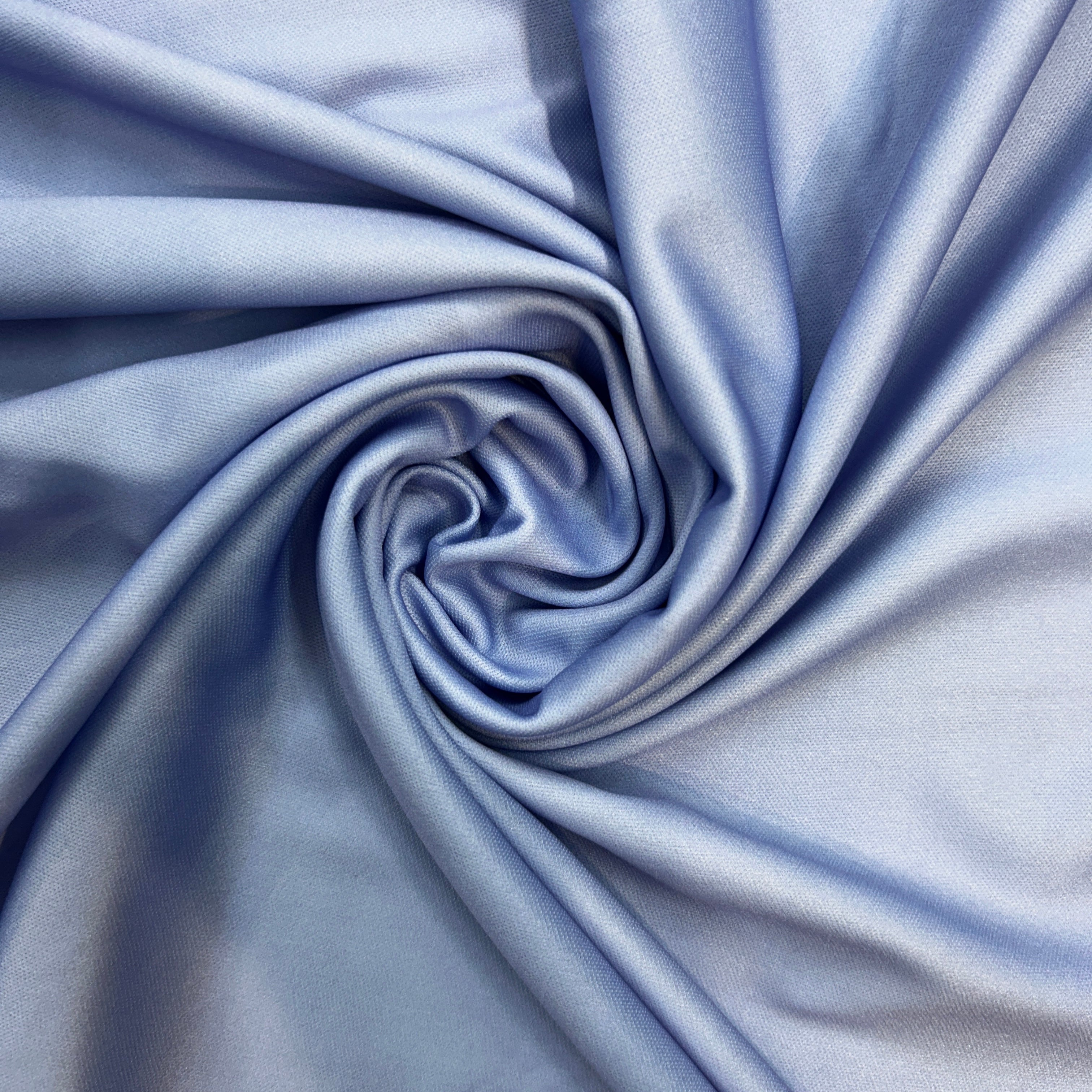 Close-up of blue fabric with folds