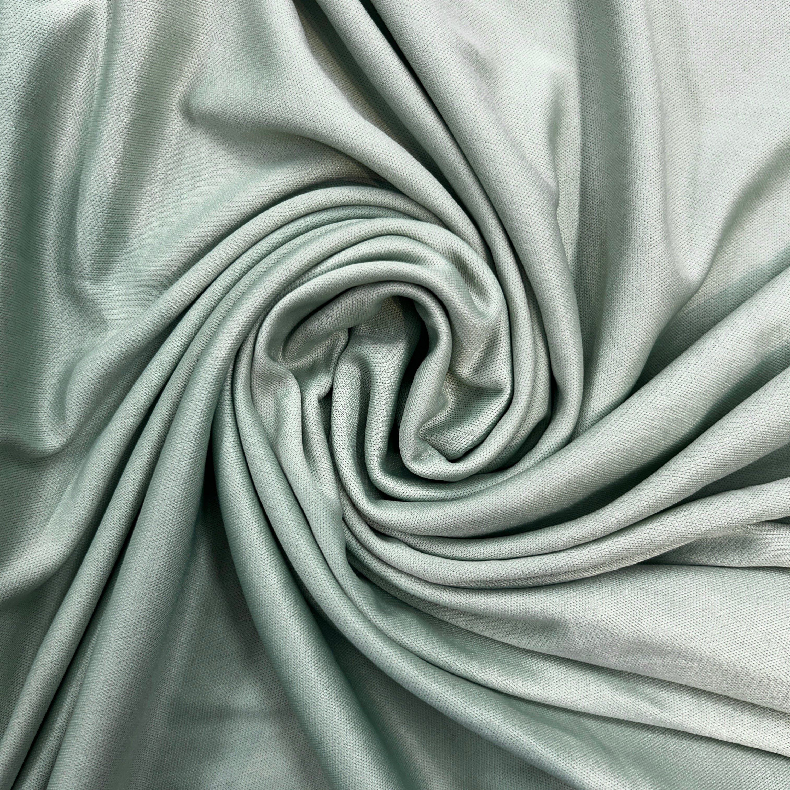 Close-up of light gray fabric with folds