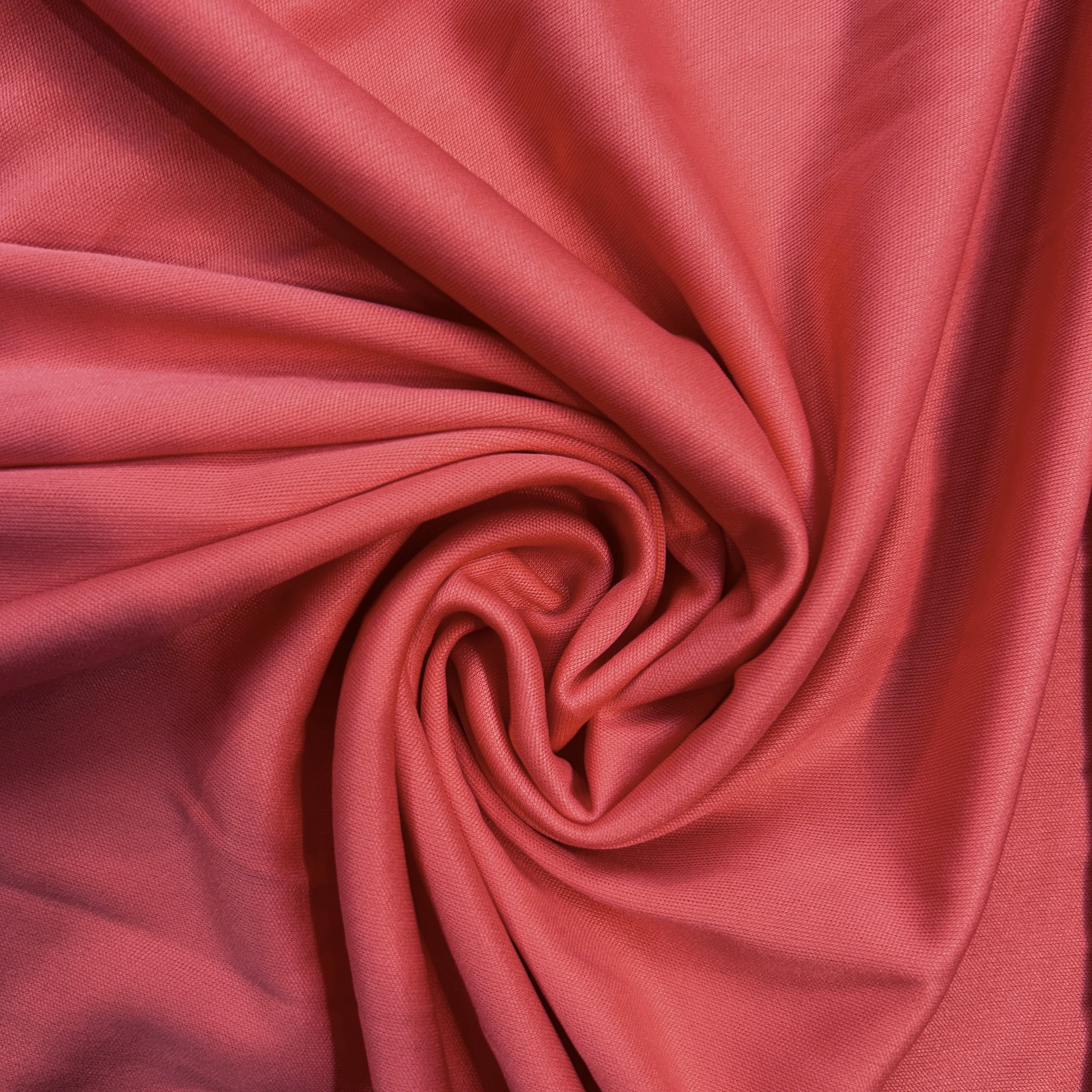 Close-up of pink fabric with a swirl pattern