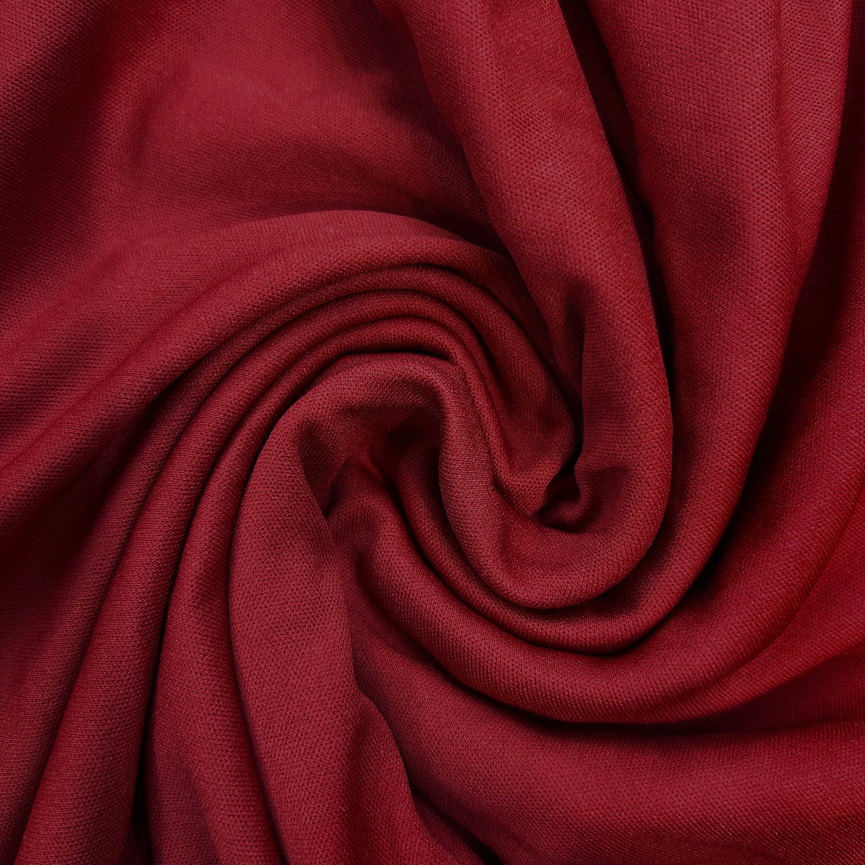 Close-up of red fabric with a swirl pattern
