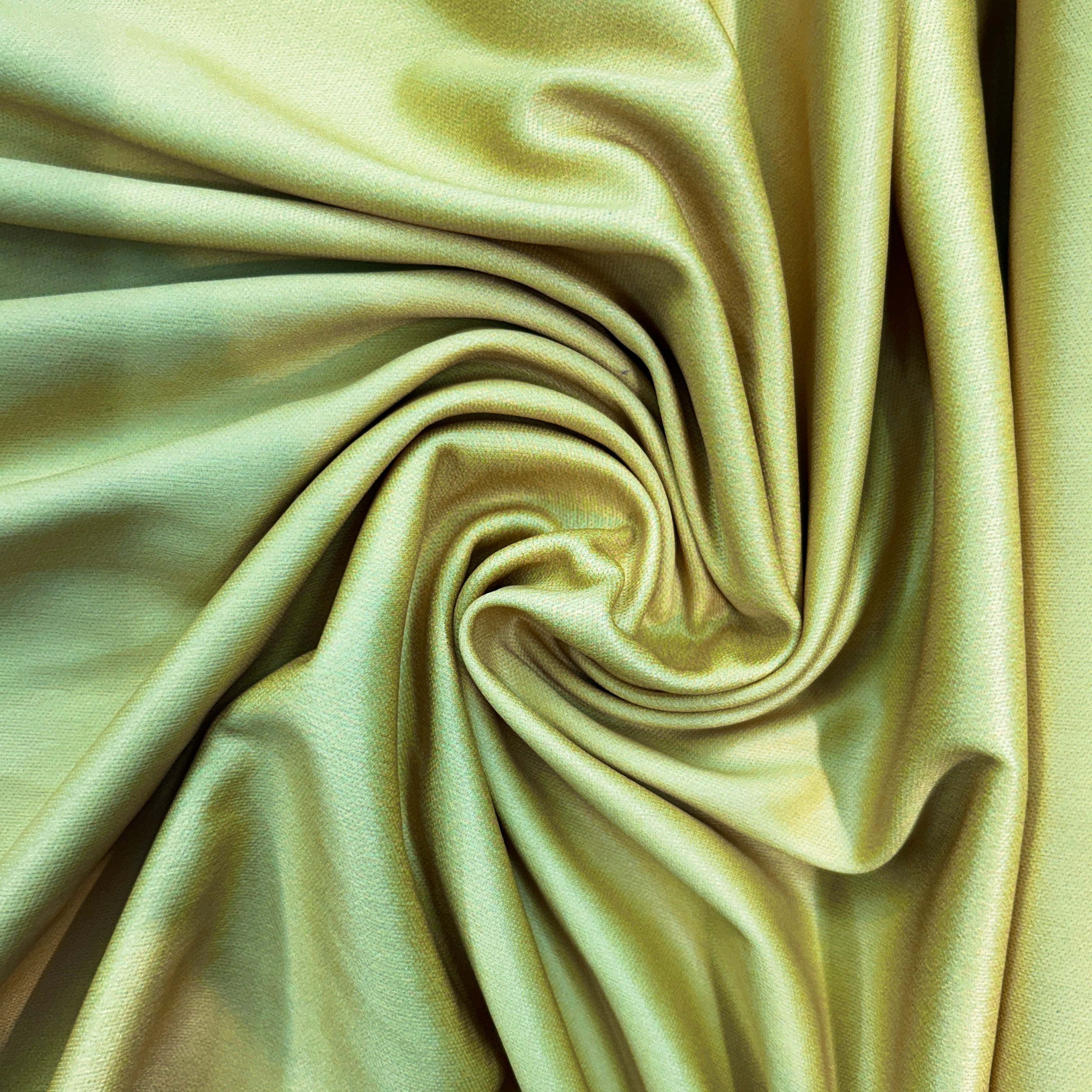 Close-up of light green fabric with folds