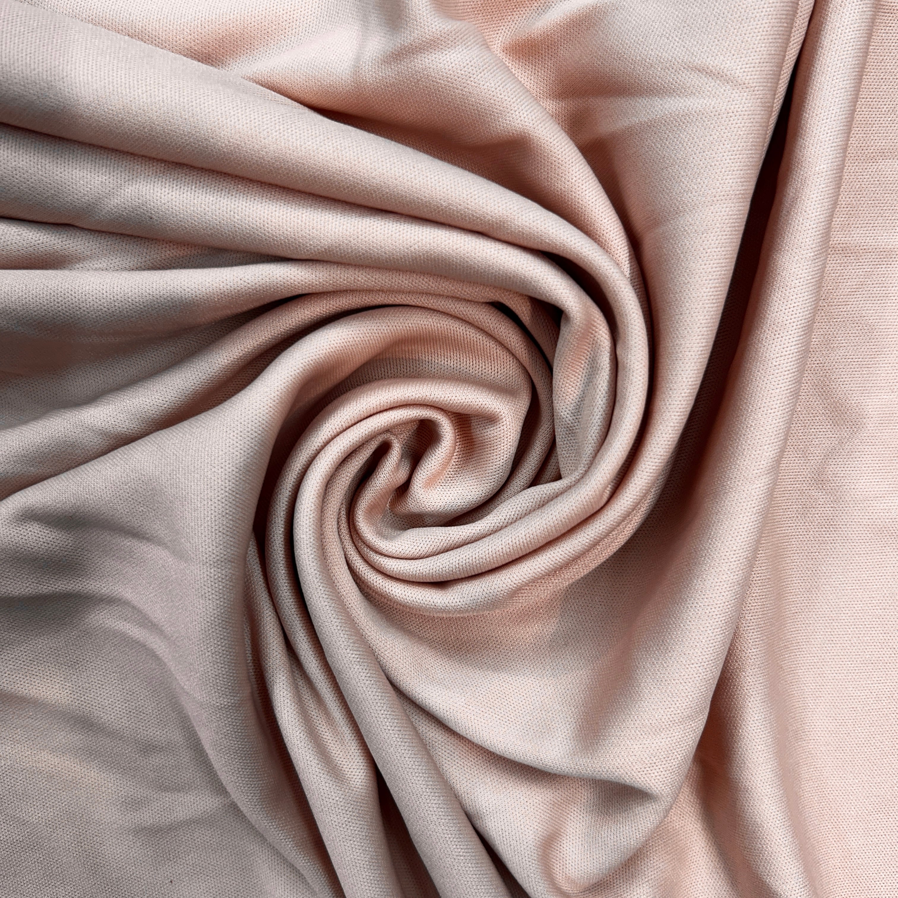 Close-up of pink fabric with folds