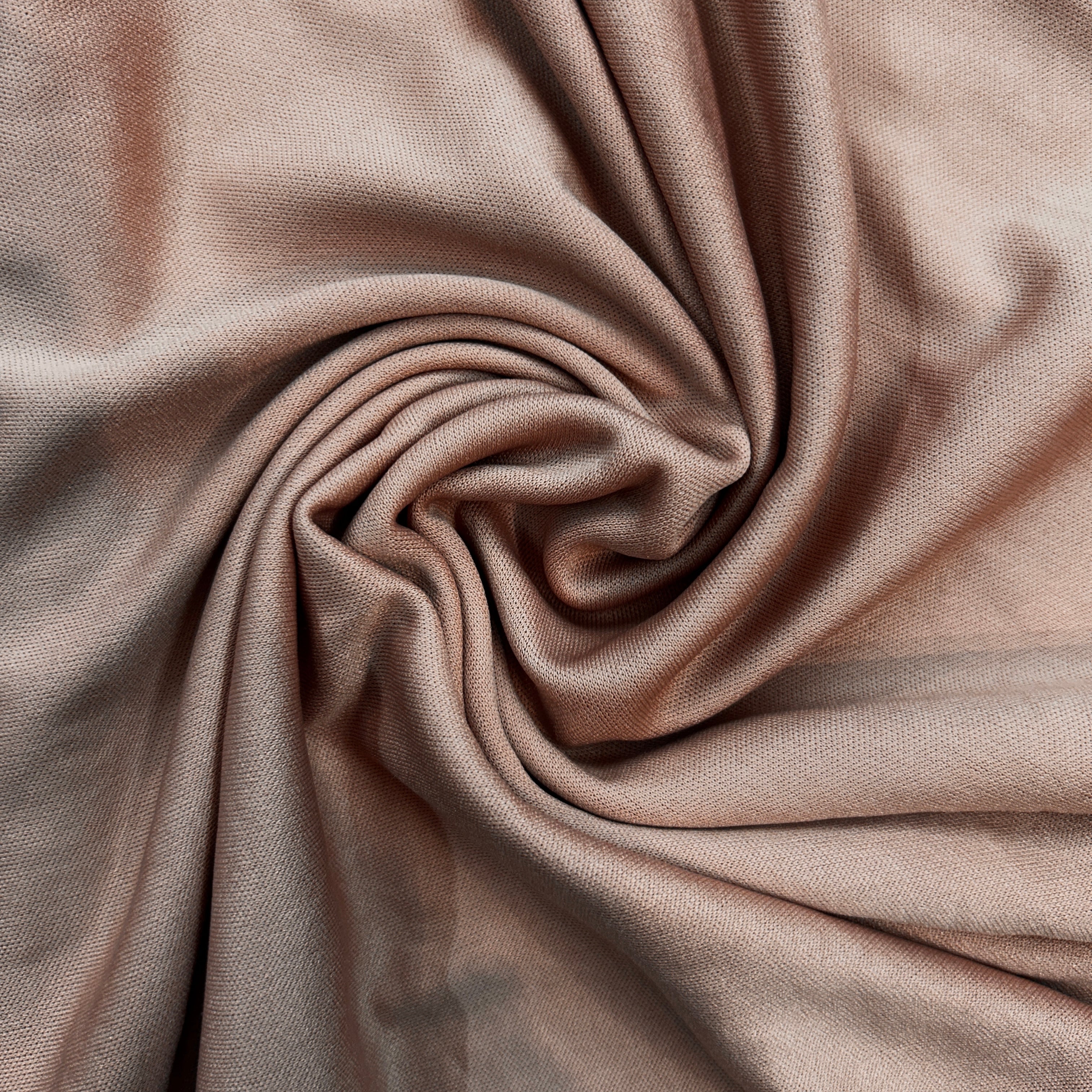 Close-up of beige fabric with folds