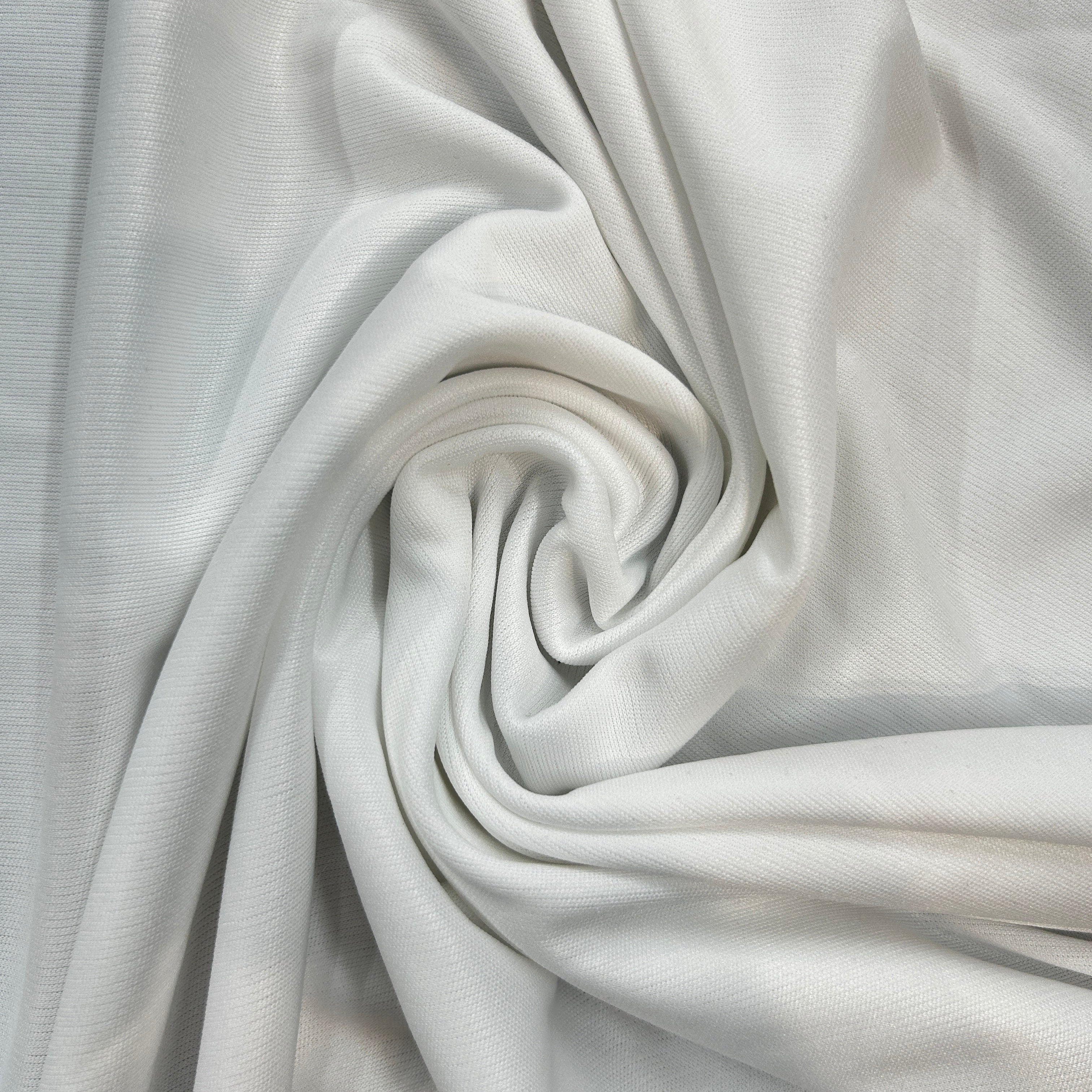 Close-up of light gray fabric with a swirling pattern
