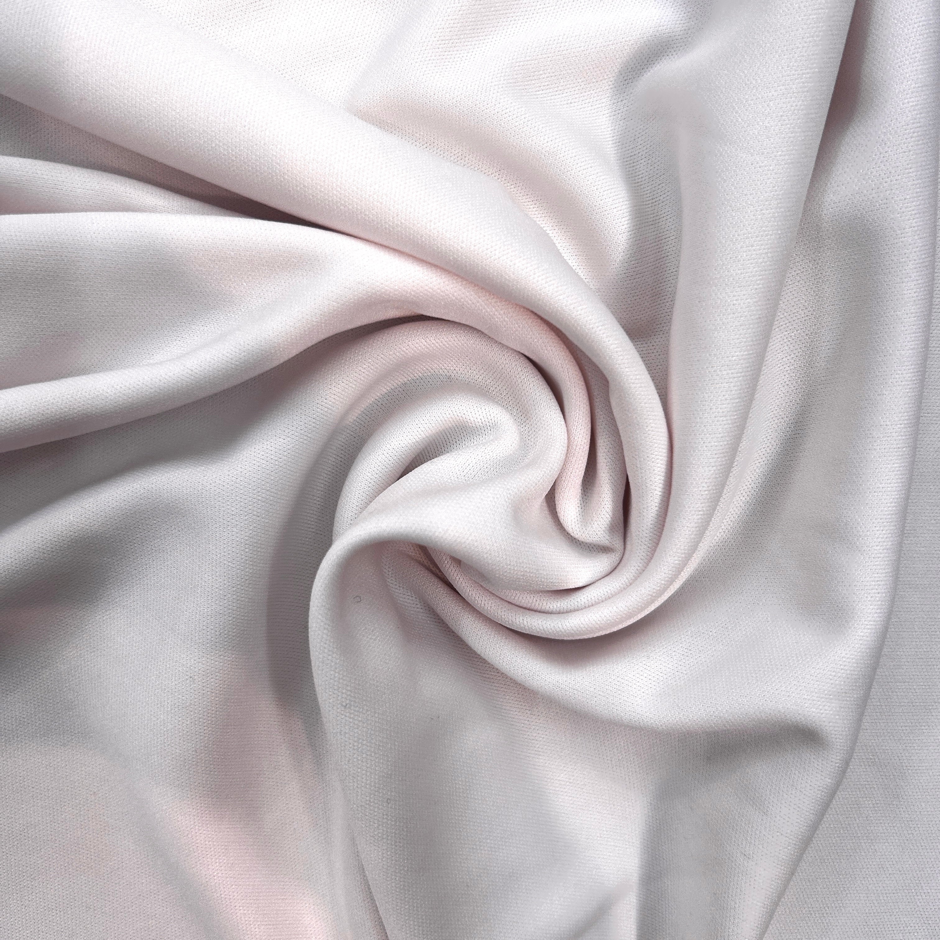 Close-up of white fabric with folds