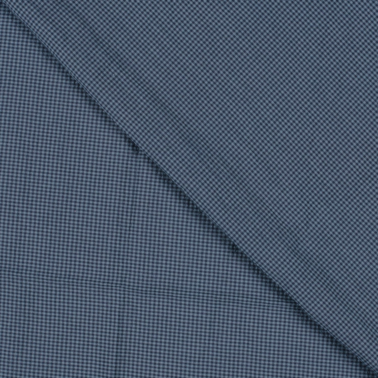 Two different textures of blue fabric with a checkered pattern on a diagonal