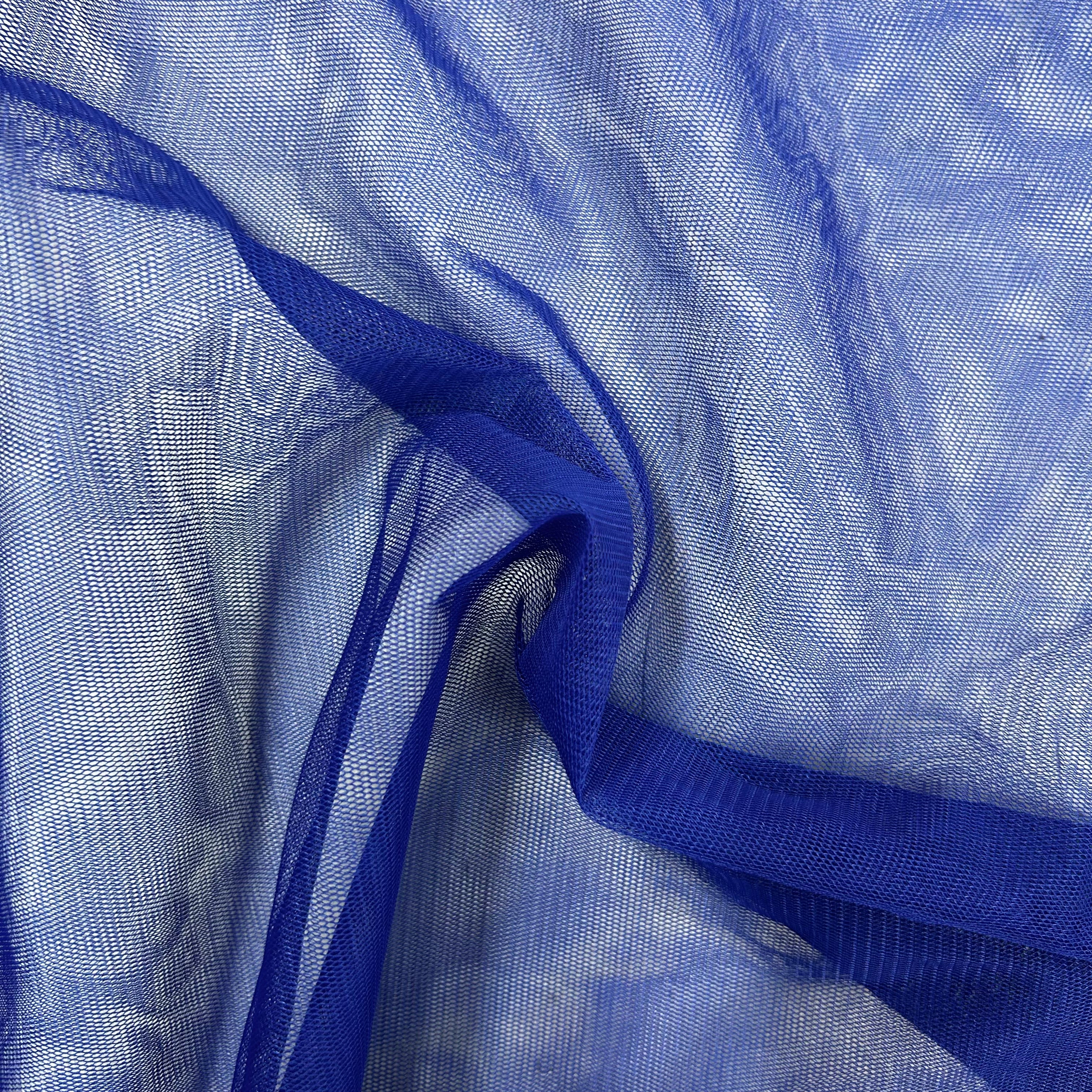 Close-up of blue sheer fabric with a white background