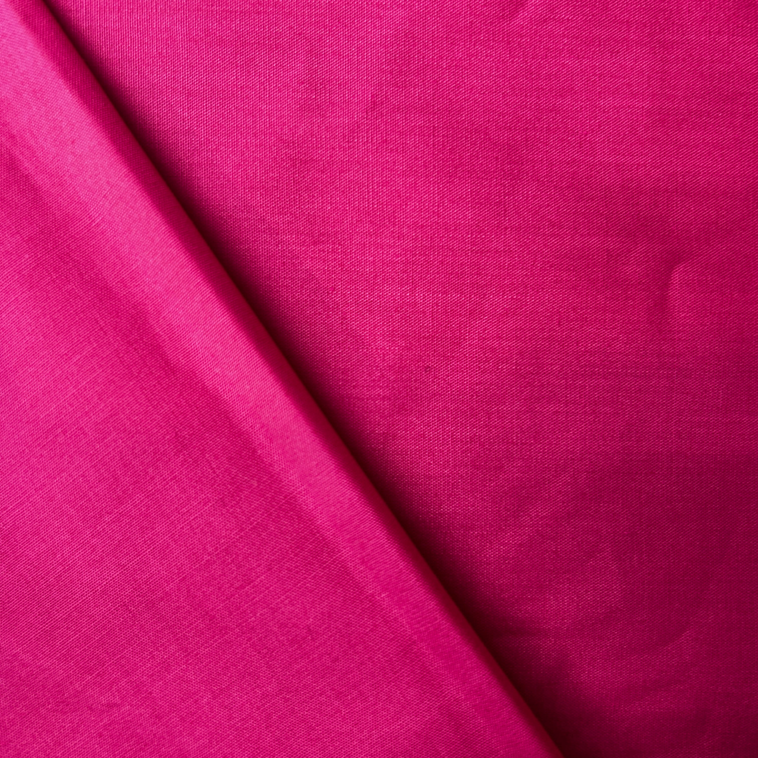 Close-up of pink fabric with a textured pattern