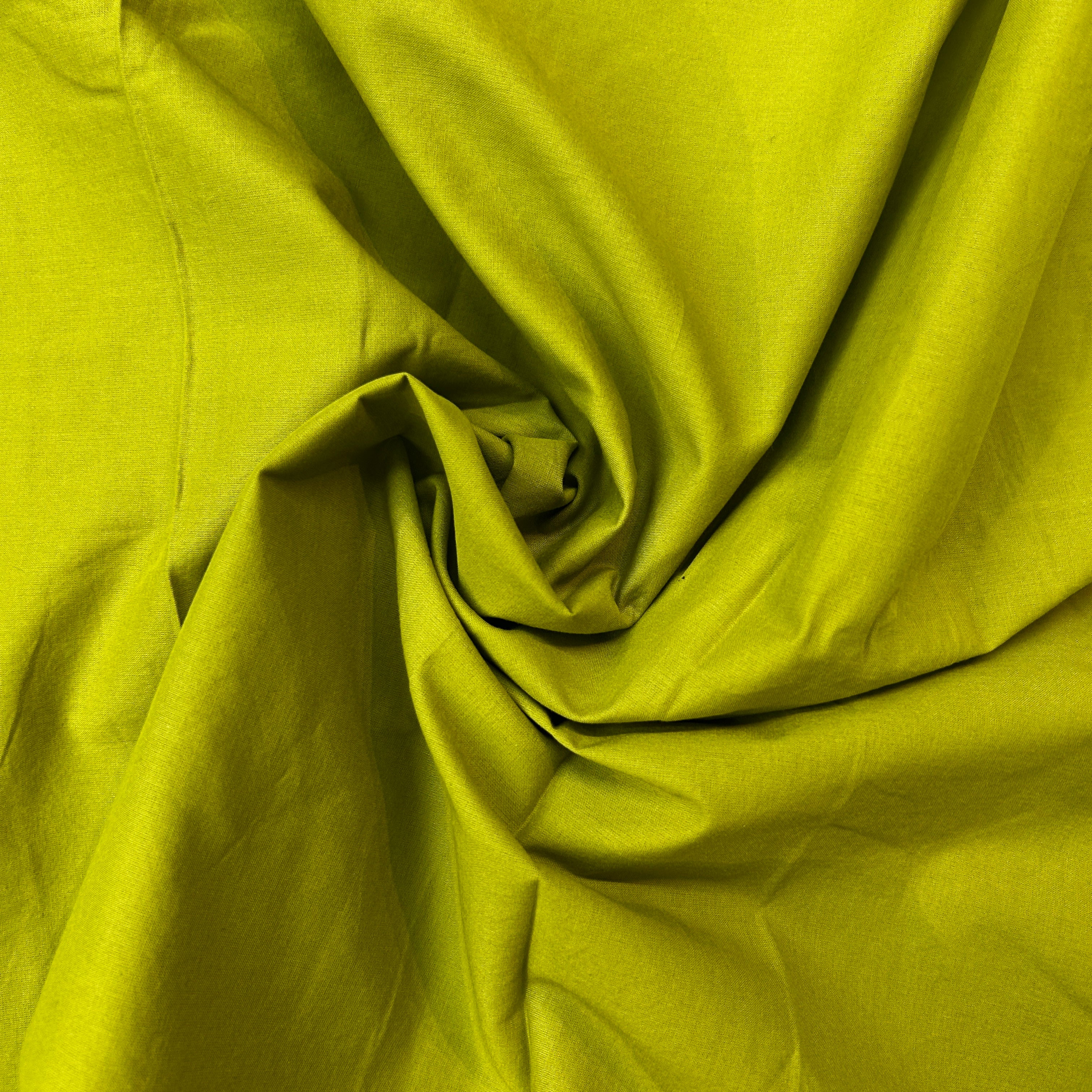 Close-up of green fabric with folds