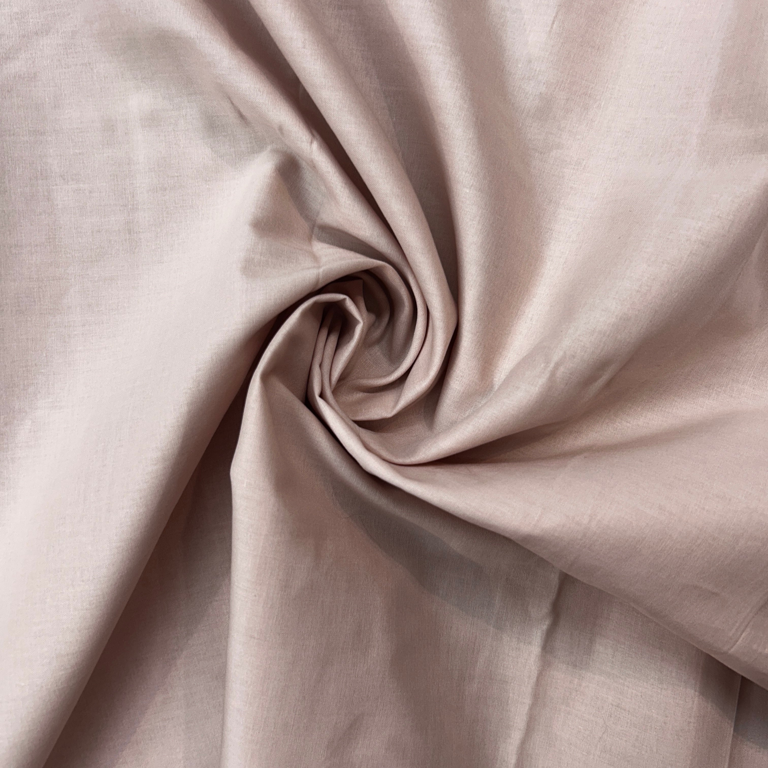Close-up of beige fabric with a subtle texture