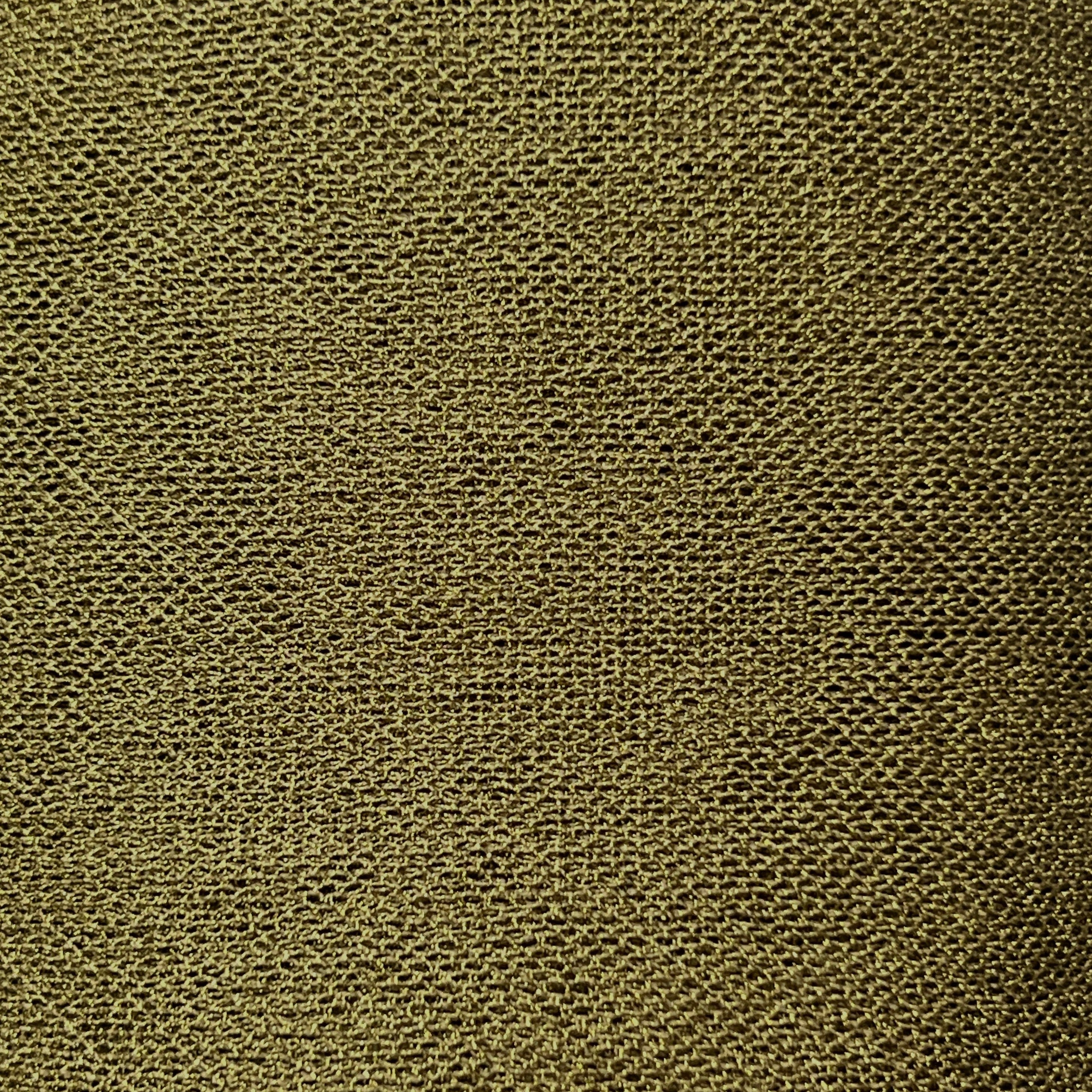 Close-up of a textured green fabric surface