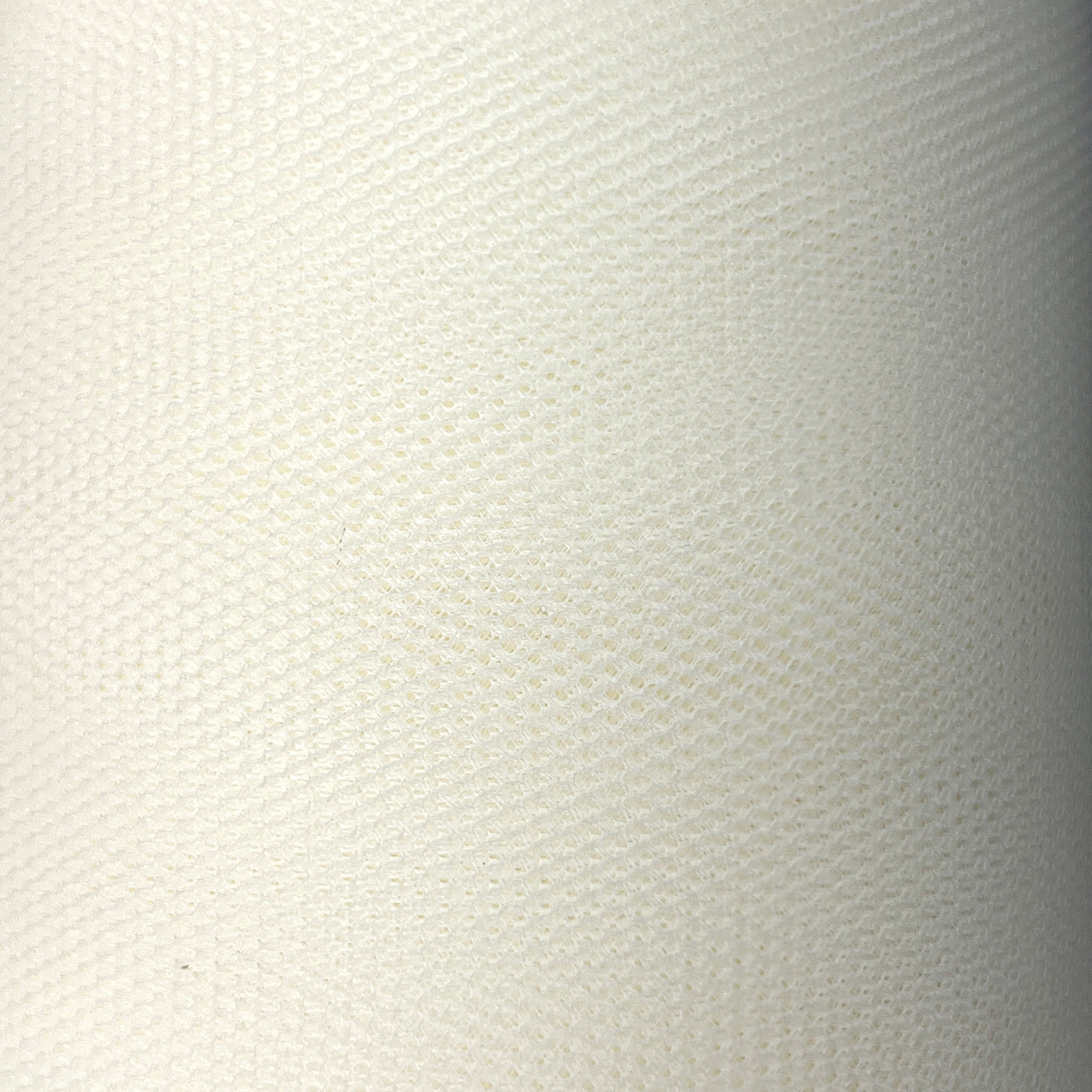 Close-up of a textured white fabric surface