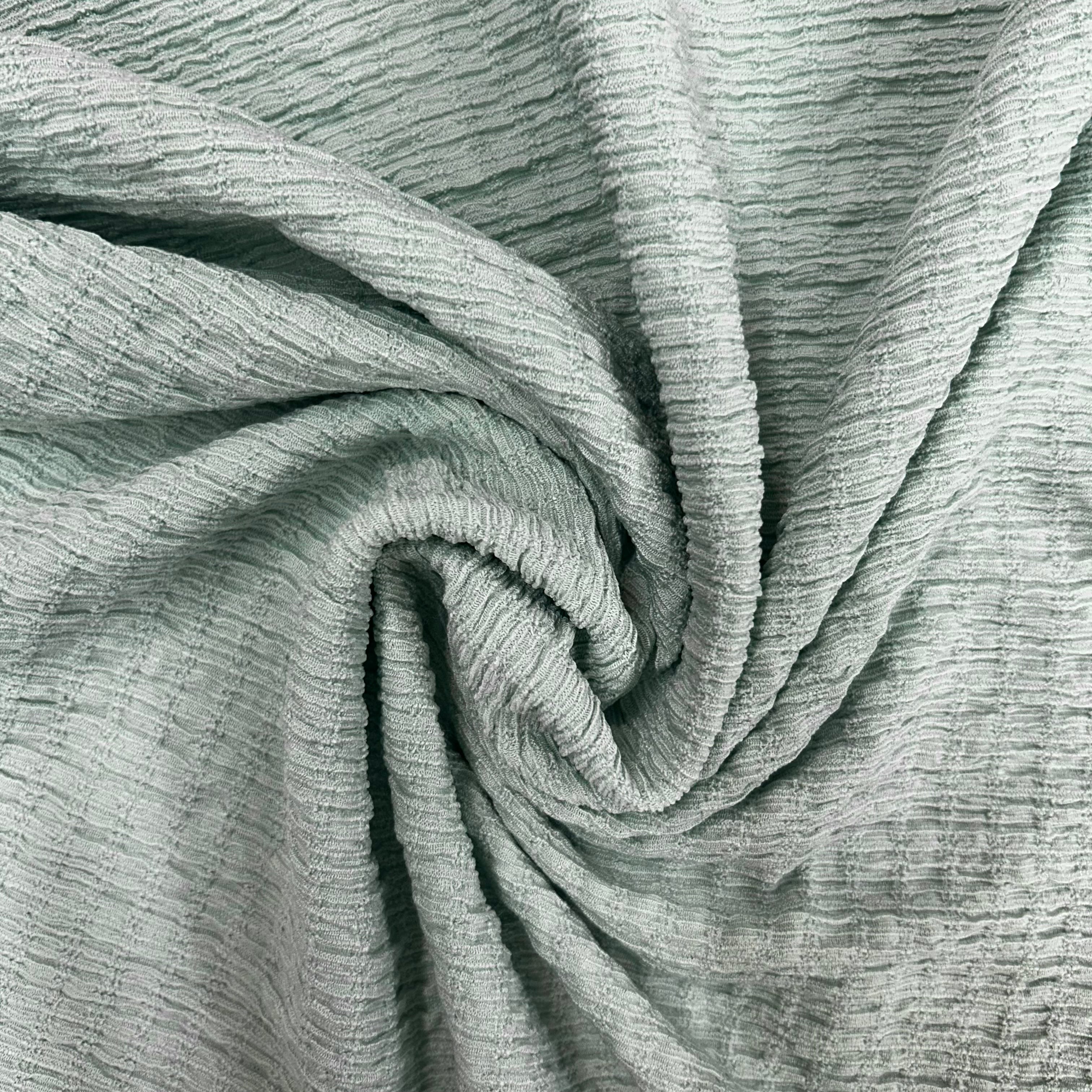 Close-up of textured gray fabric with folds