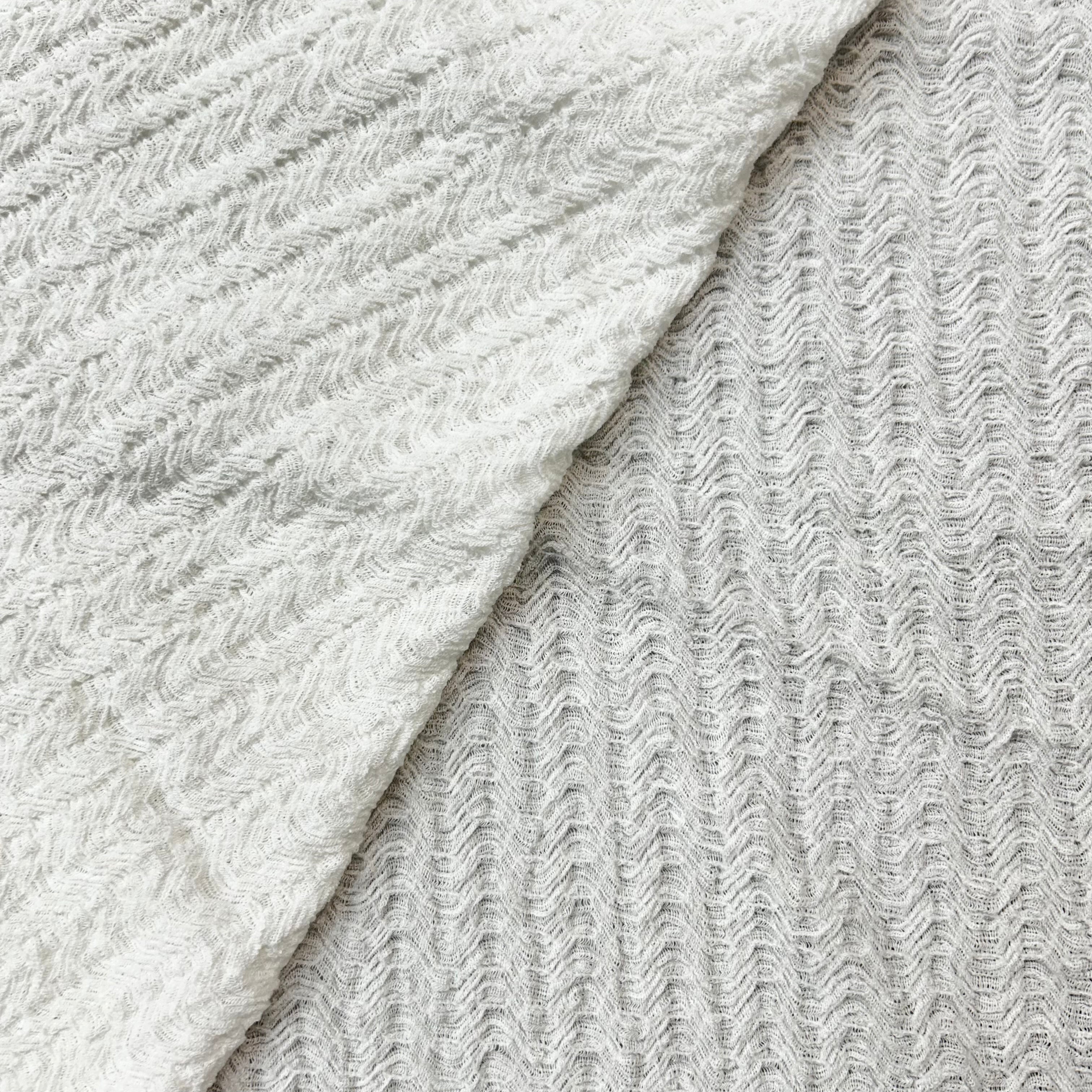 Close-up of textured gray fabric with a subtle pattern