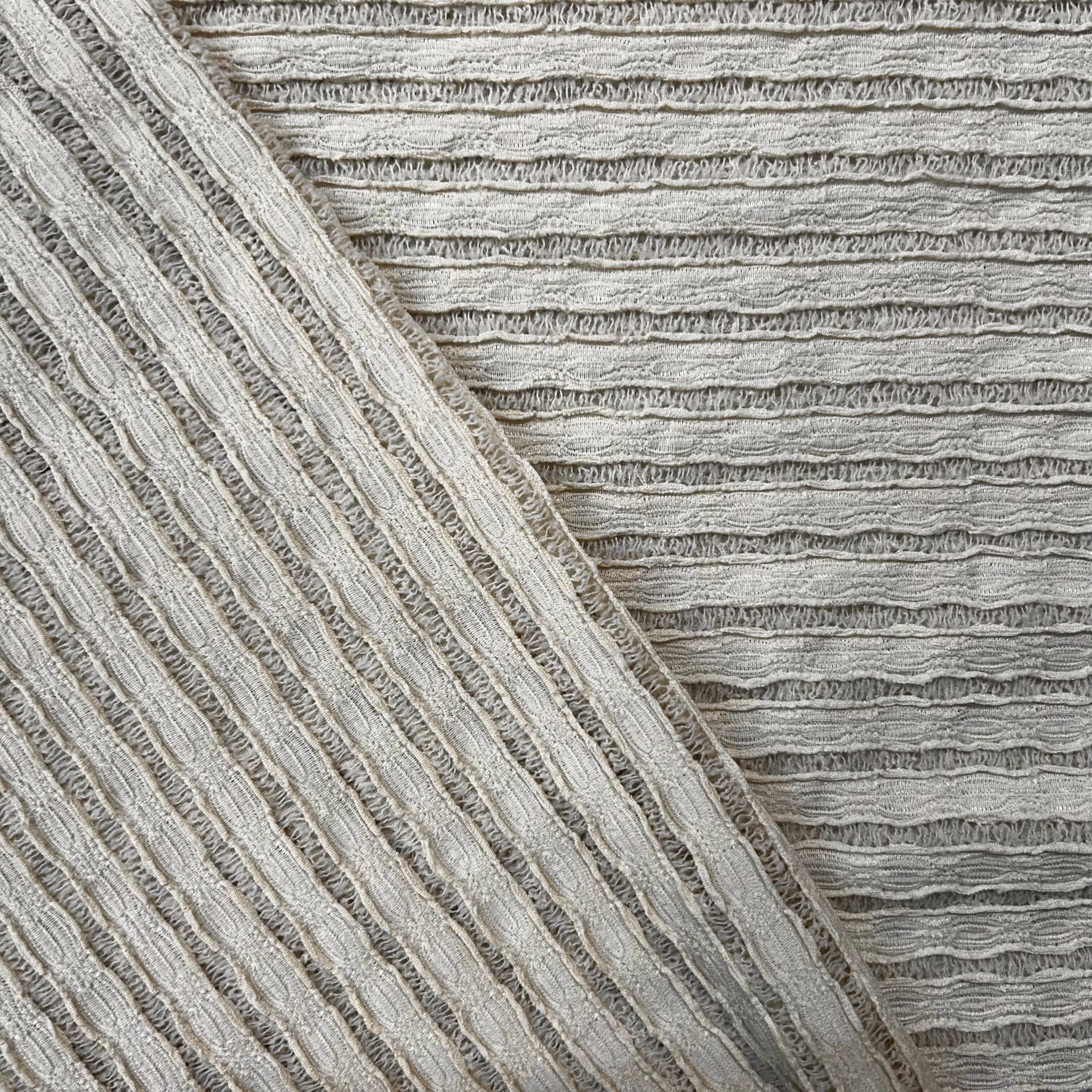 Close-up of textured gray fabric with diagonal pattern