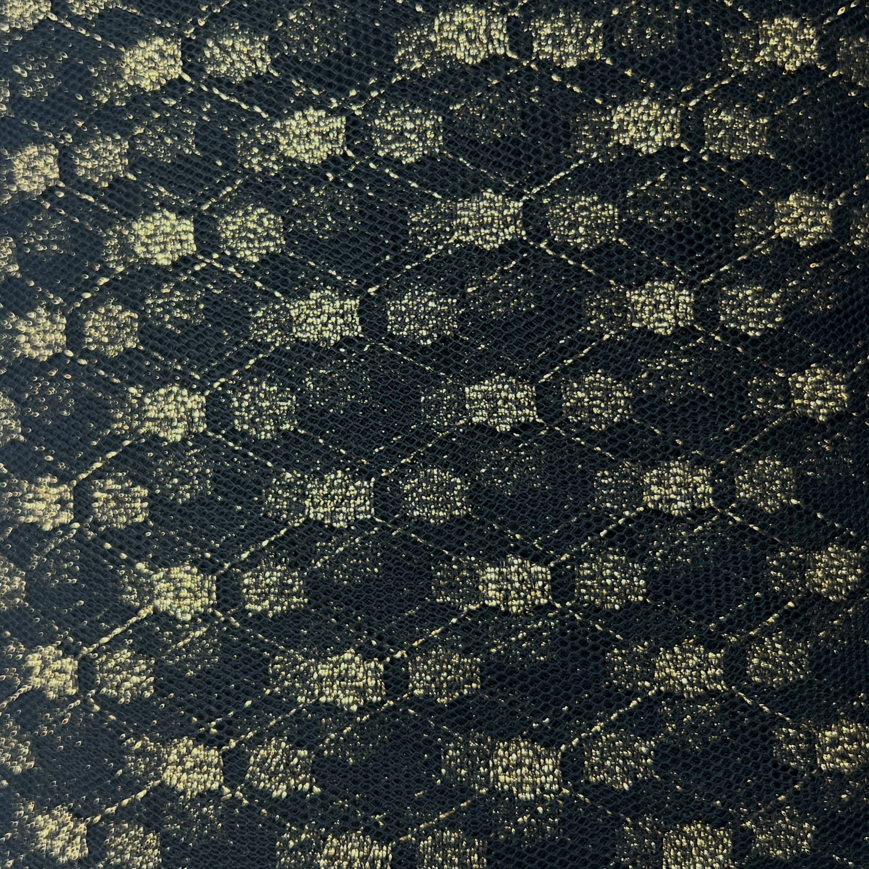 Hexagonal patterned fabric in green and black