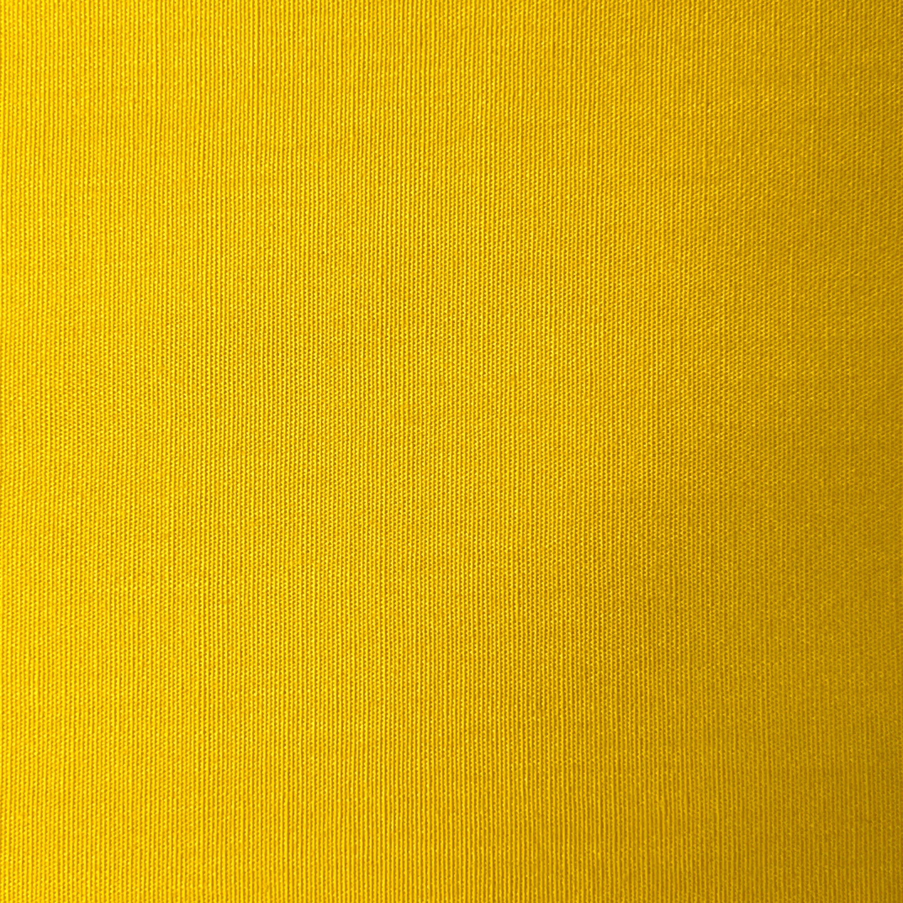 Yellow 100% cotton poplin fabric with a plain weave texture.