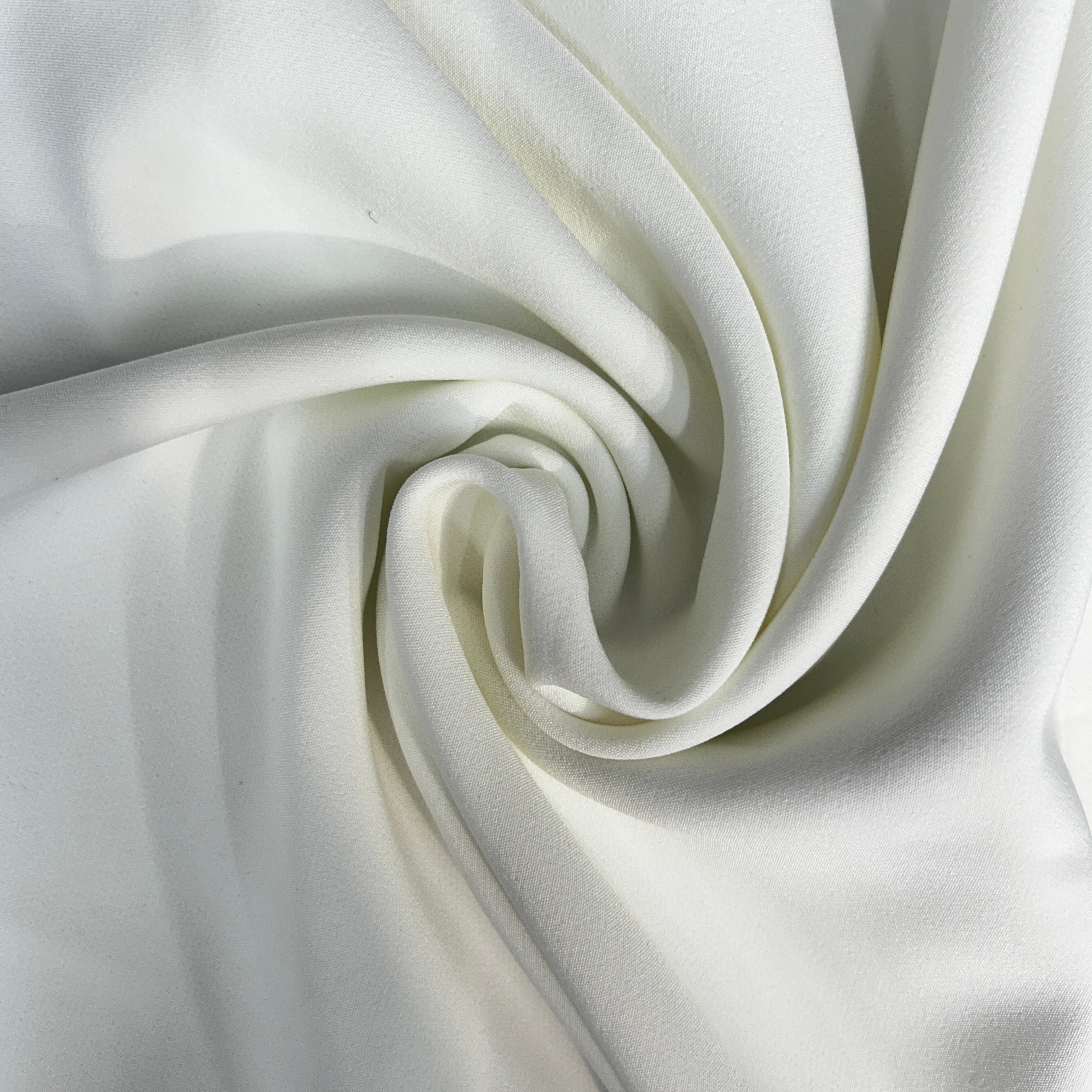 Close-up of white fabric with folds