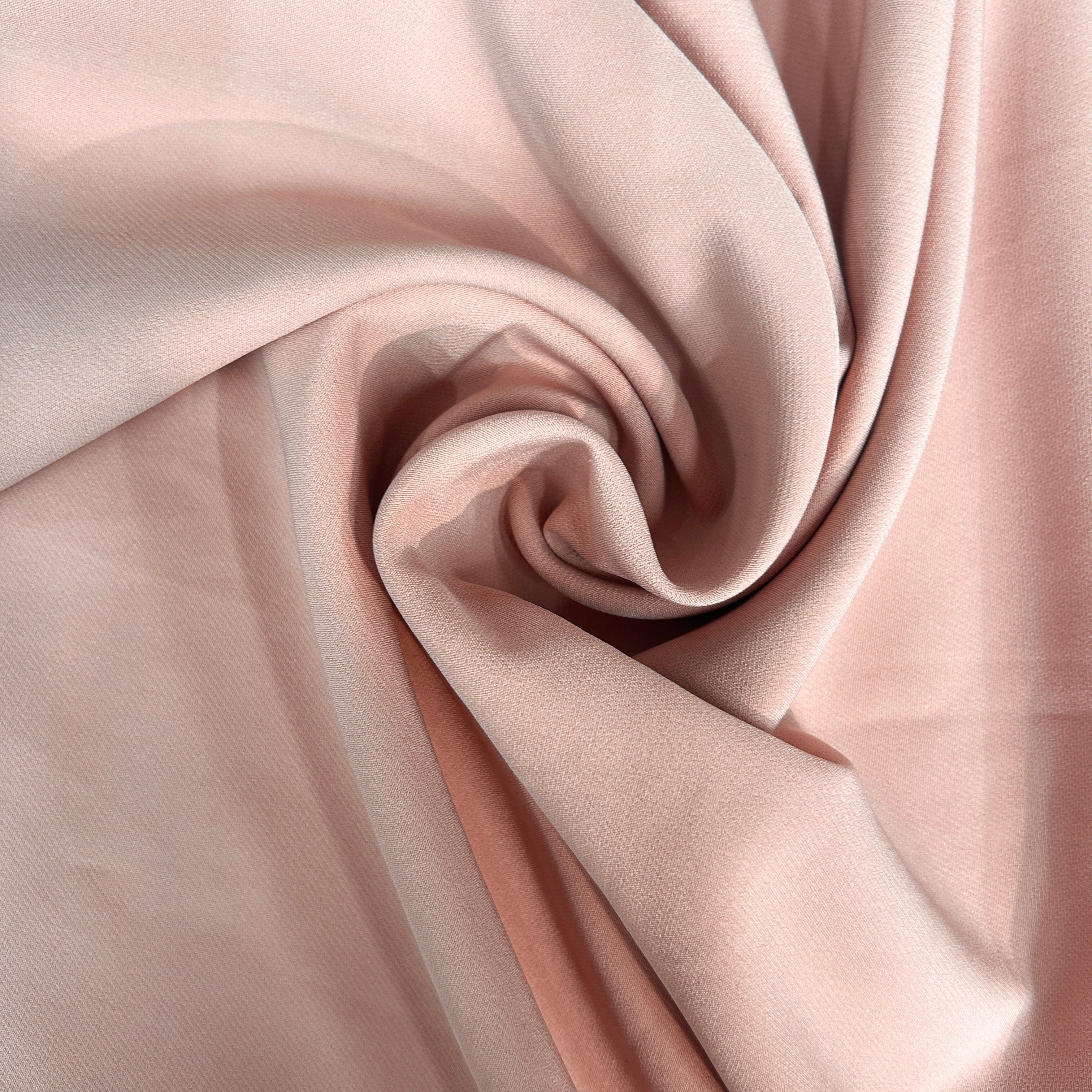 Close-up of pink fabric with a swirl pattern