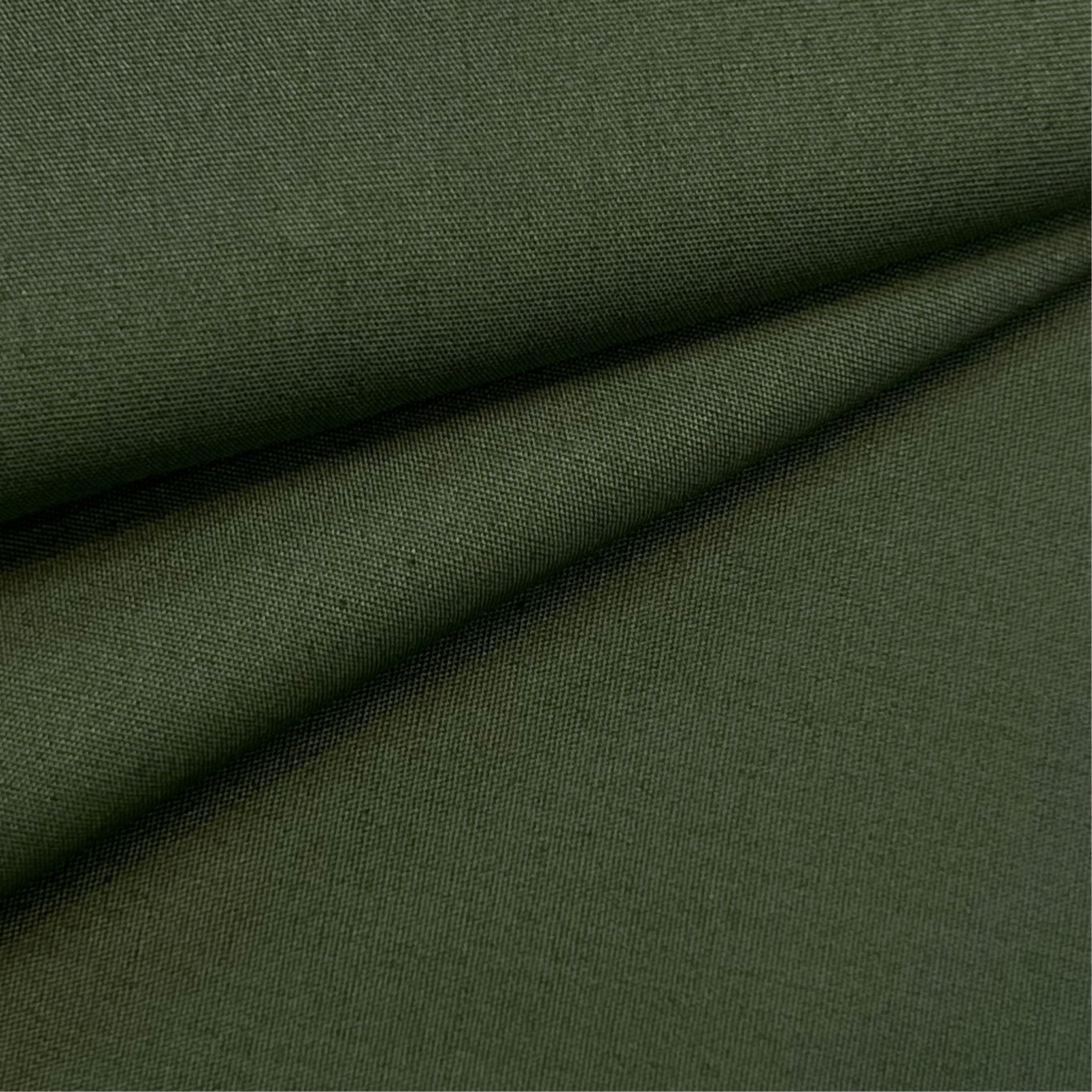 Dark green cotton poplin fabric with a visible weave.