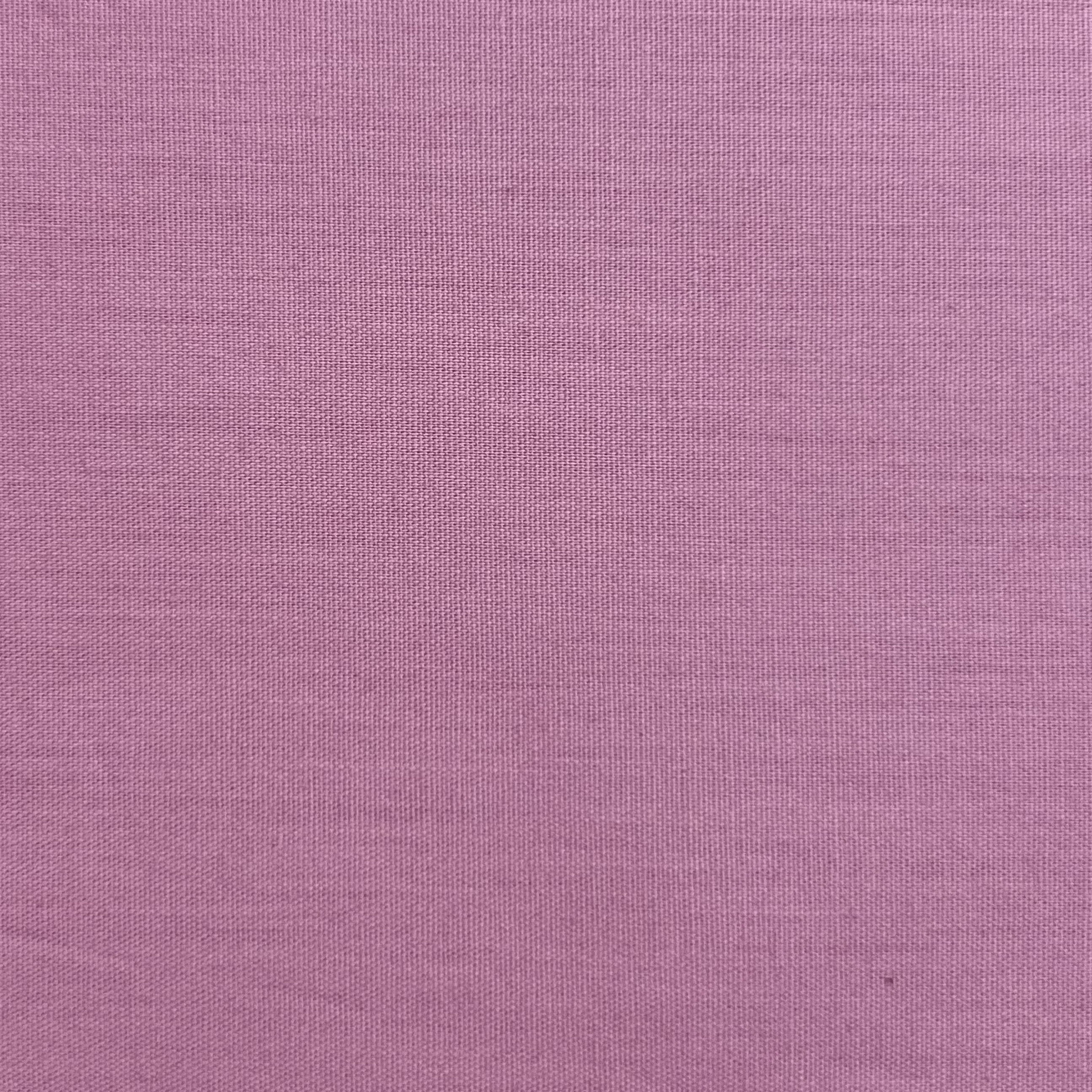 A plain weave cotton poplin fabric in a soft pink hue.