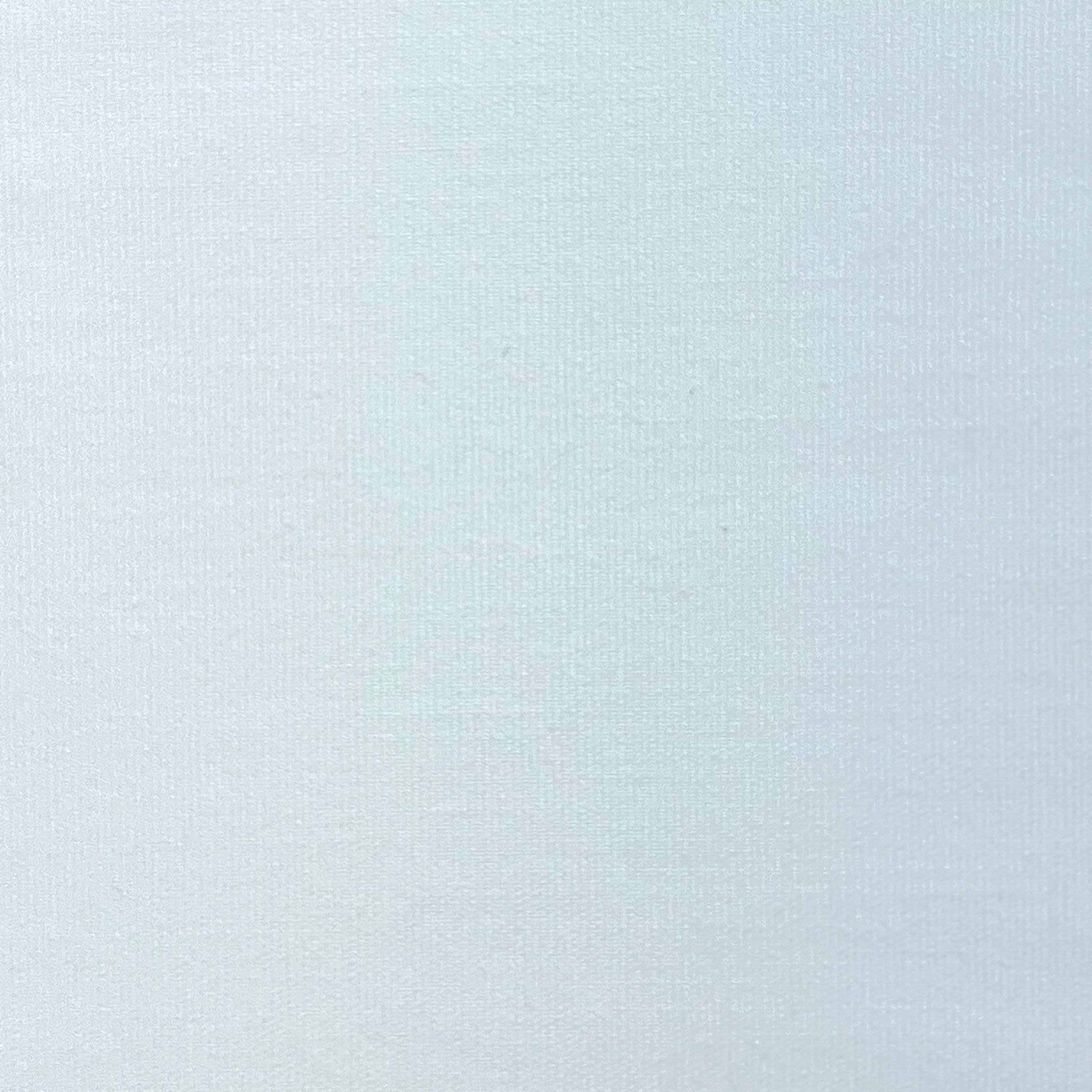 Cotton poplin fabric in a solid color with a smooth, crisp texture.