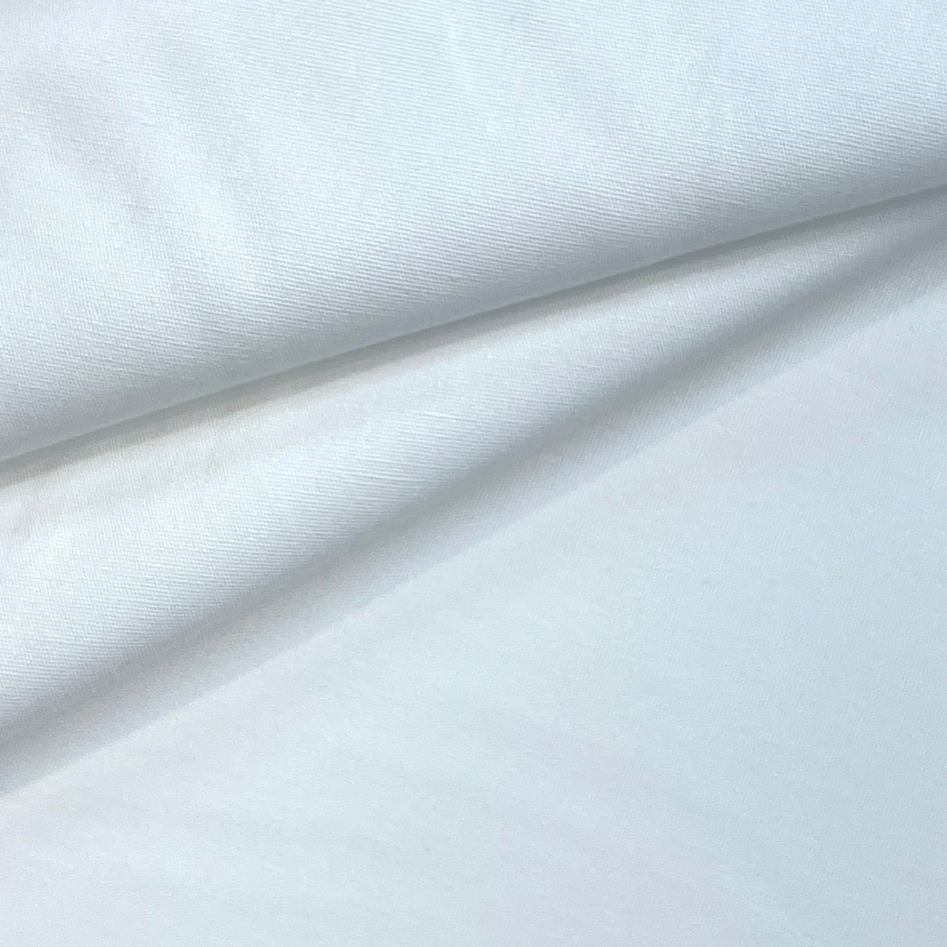 White cotton poplin fabric with a smooth, crisp texture.