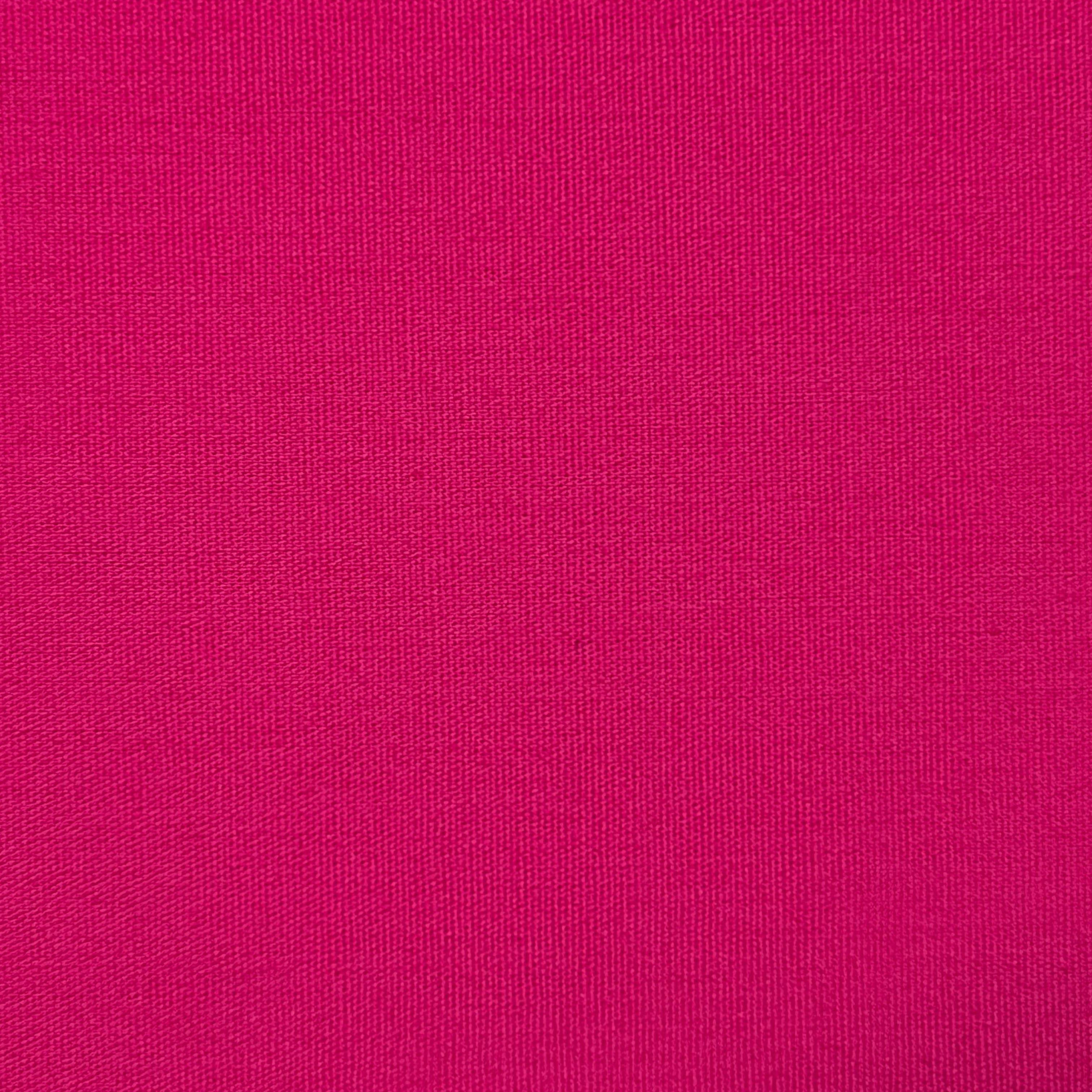 A bright pink textured cotton fabric.