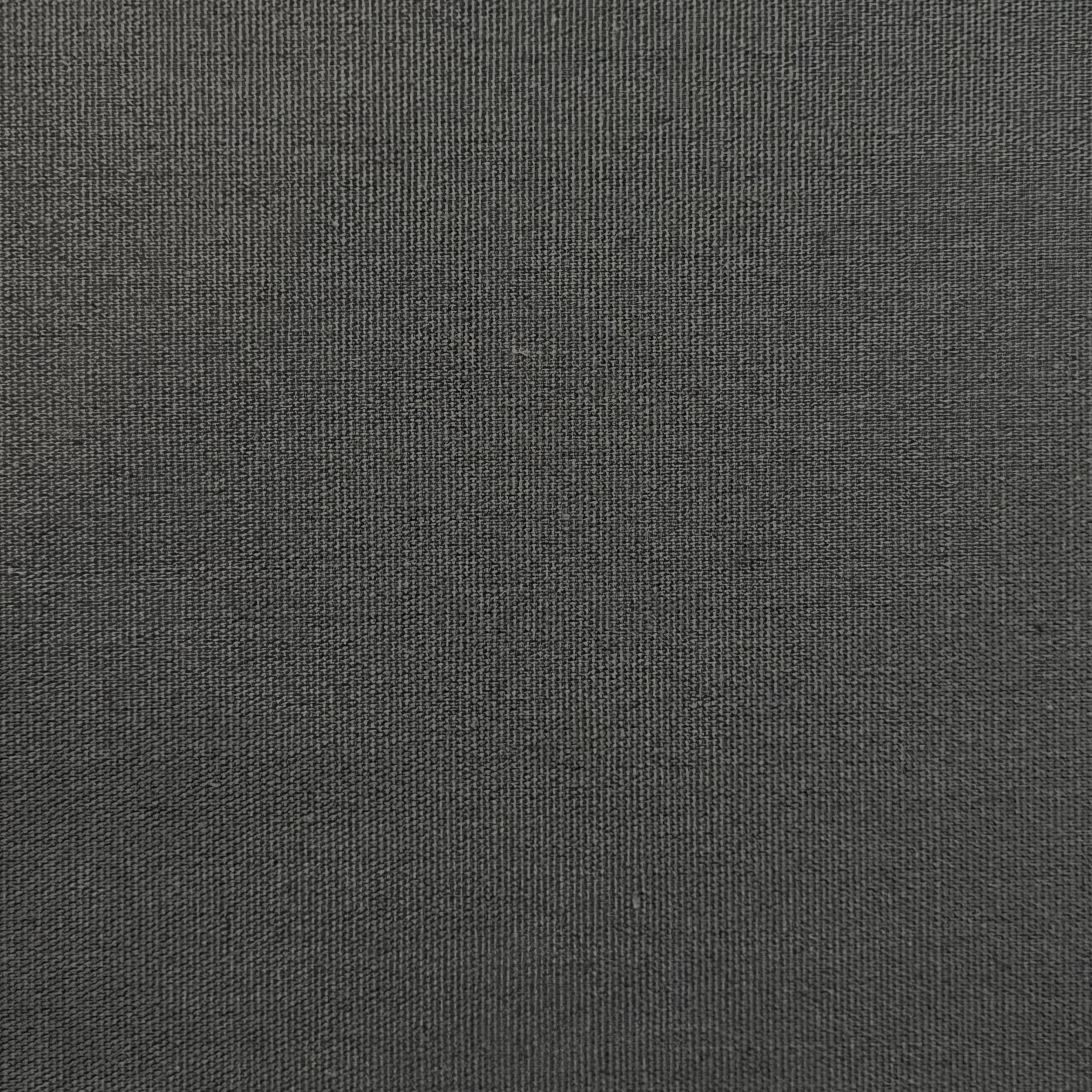 Close-up of dark grey cotton poplin fabric showing its fine, tight plain weave texture.