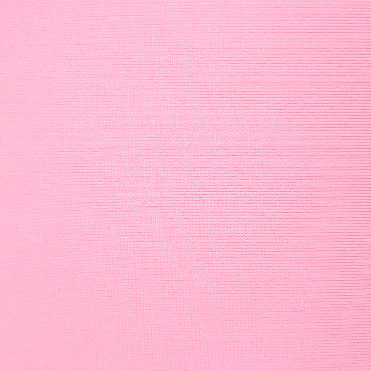 A close-up of a light pink ribbed fabric texture filling the frame.