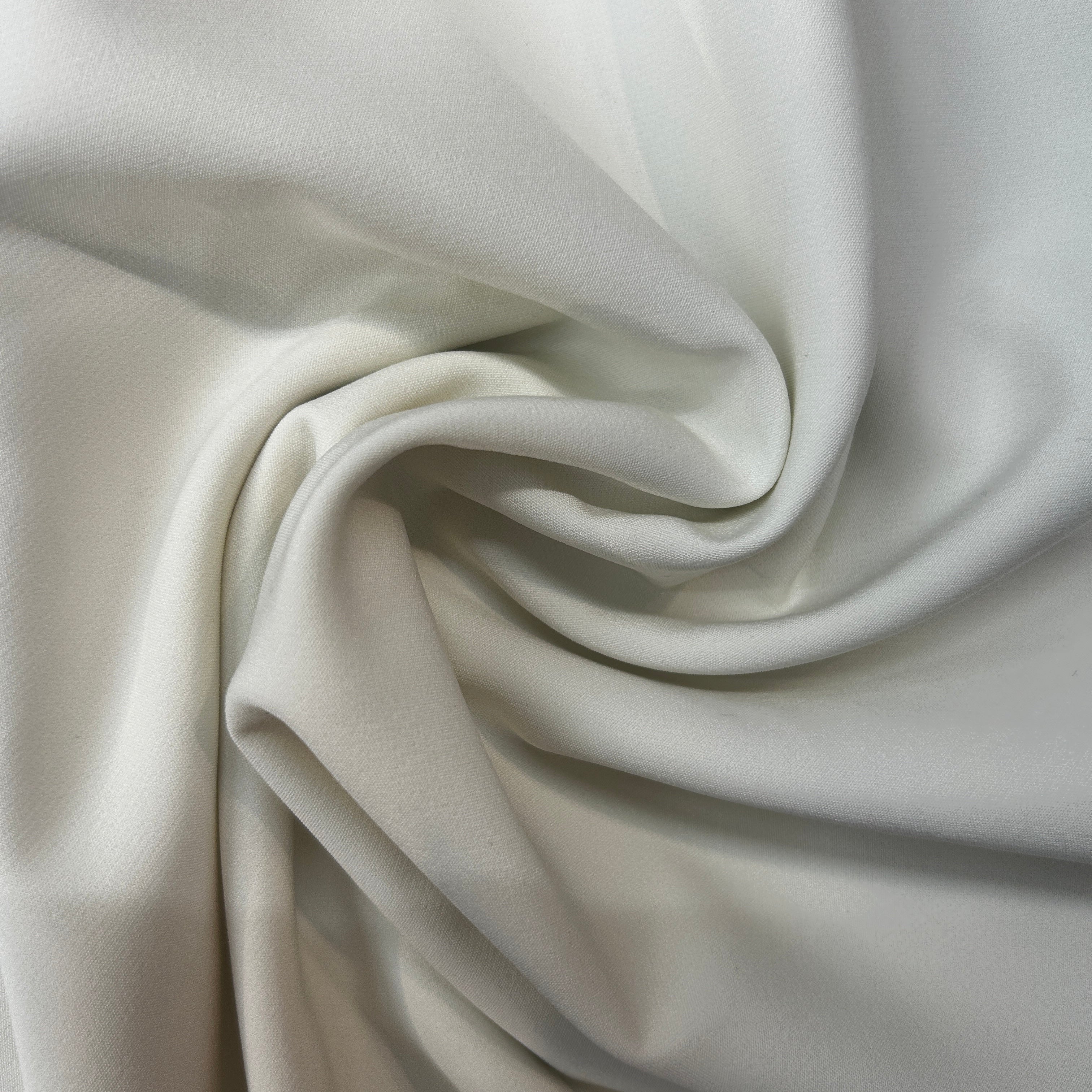 Close-up of beige fabric with folds