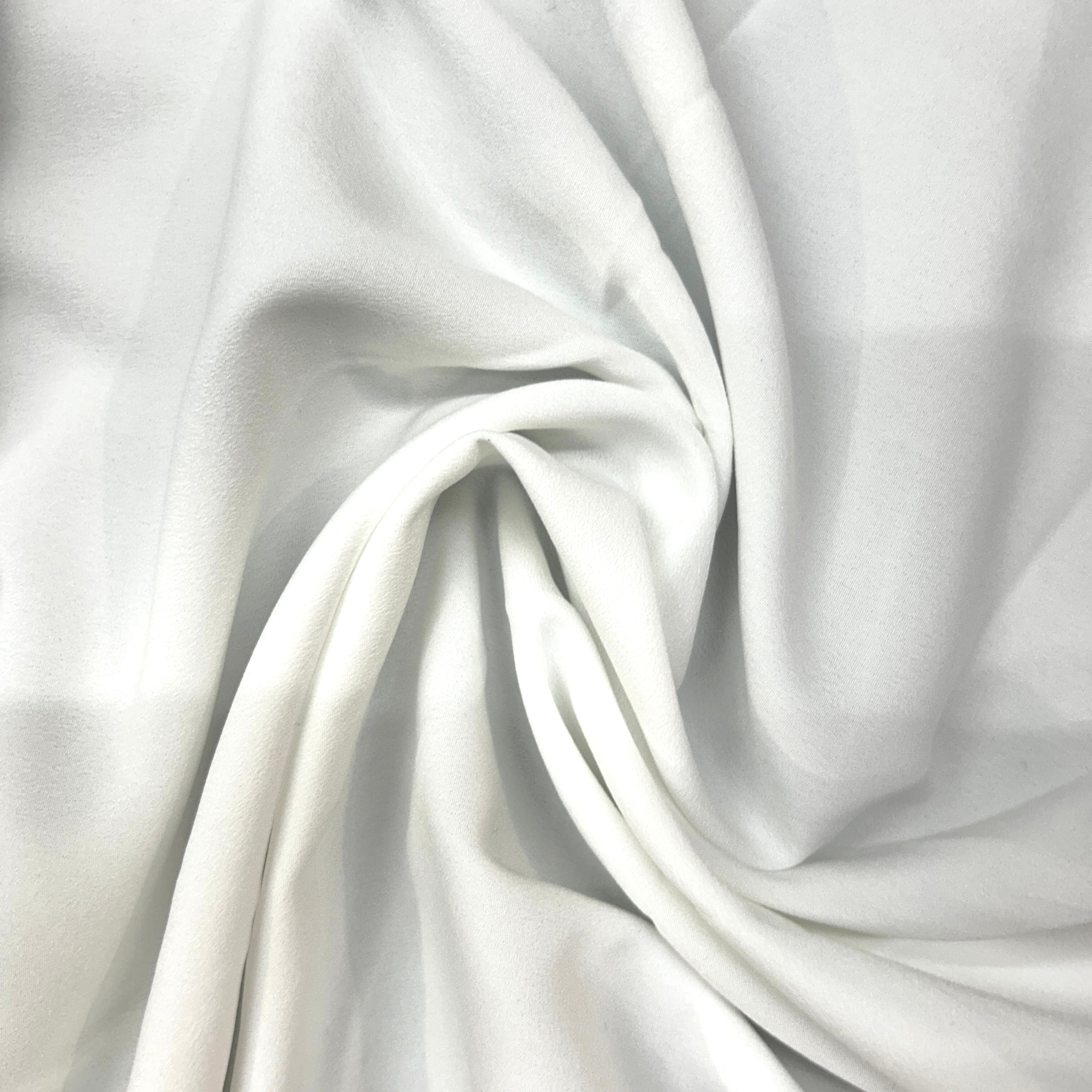 Close-up of white fabric with folds