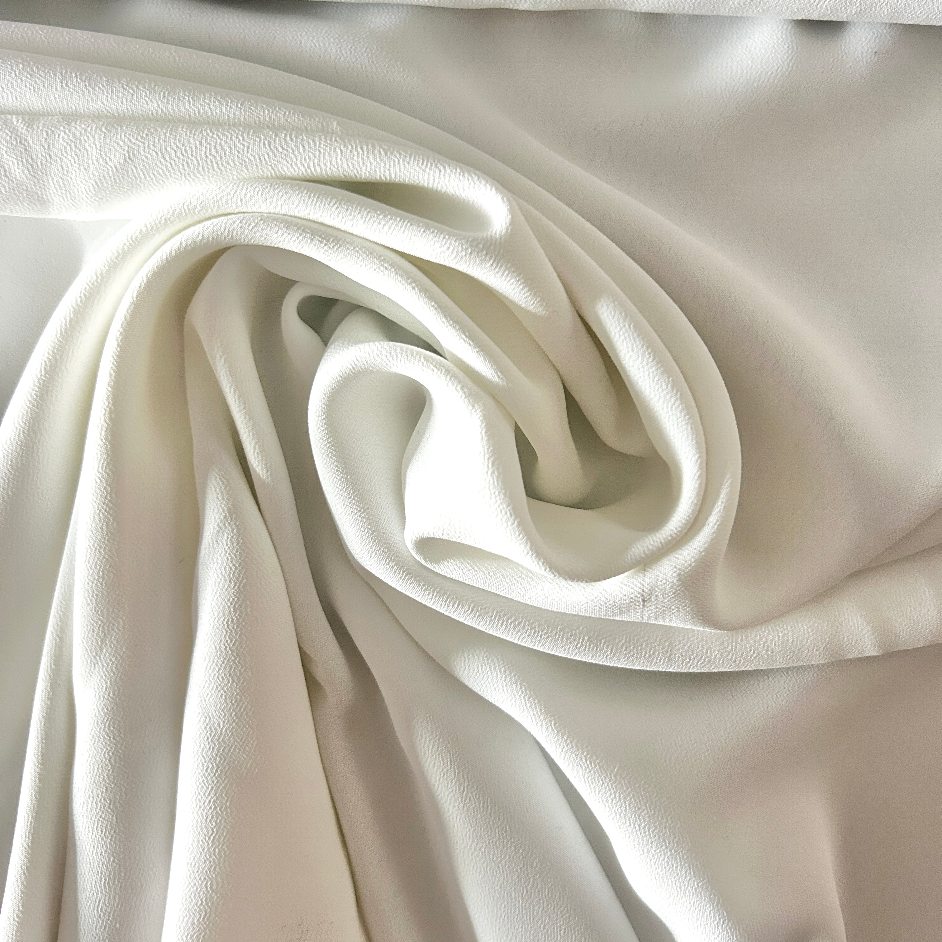 Close-up of beige fabric with folds