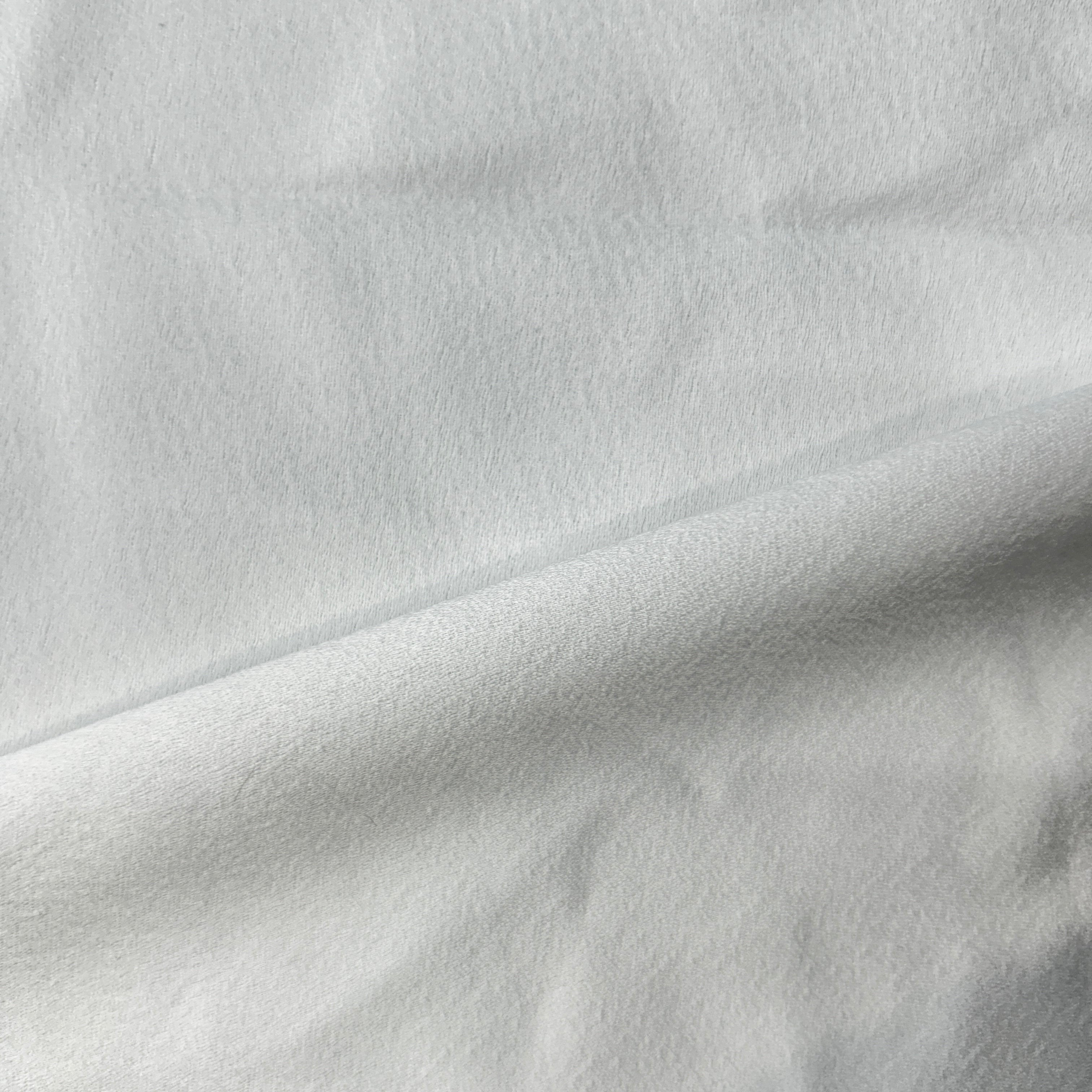 Close-up of white fabric with subtle texture