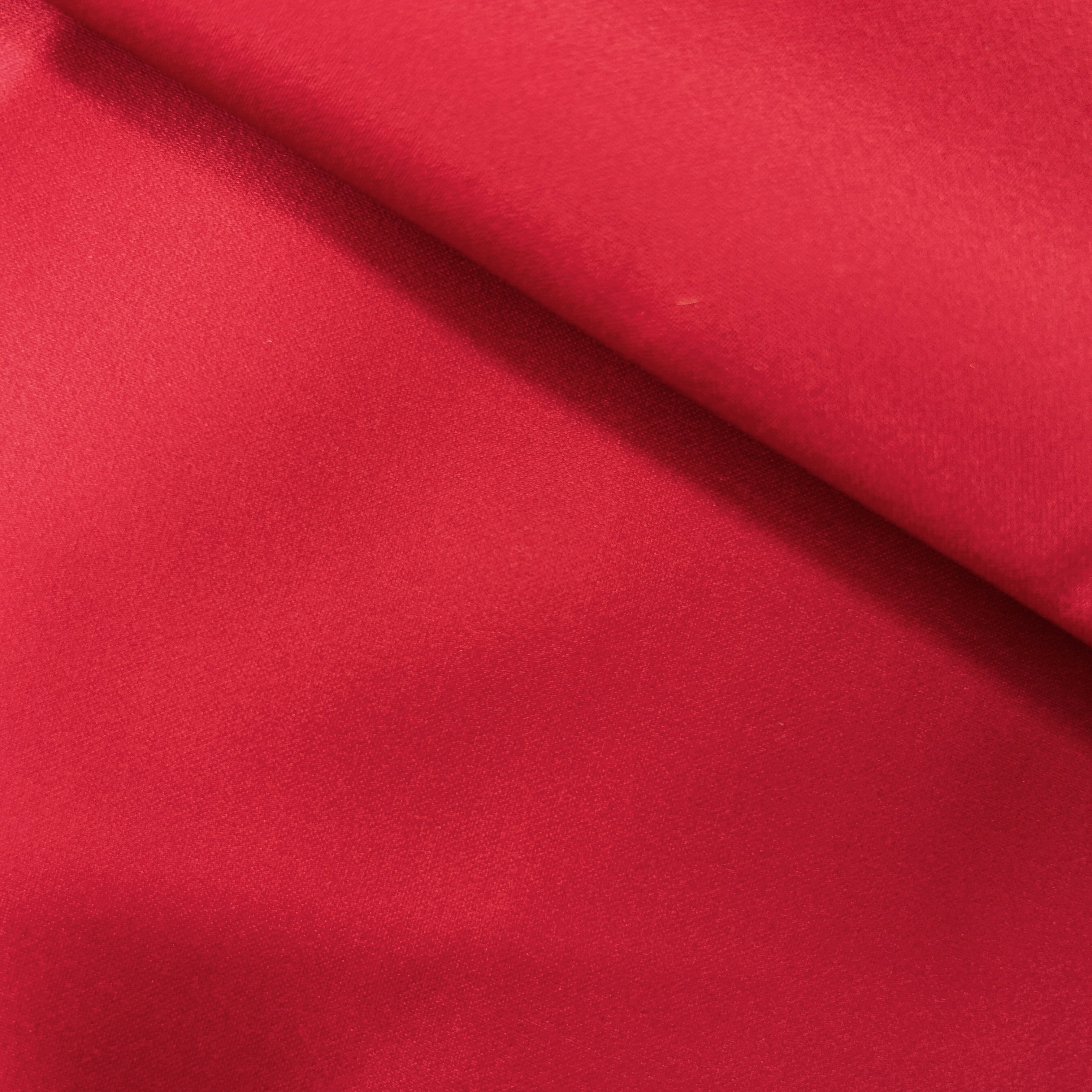 Close-up of red fabric with a subtle texture