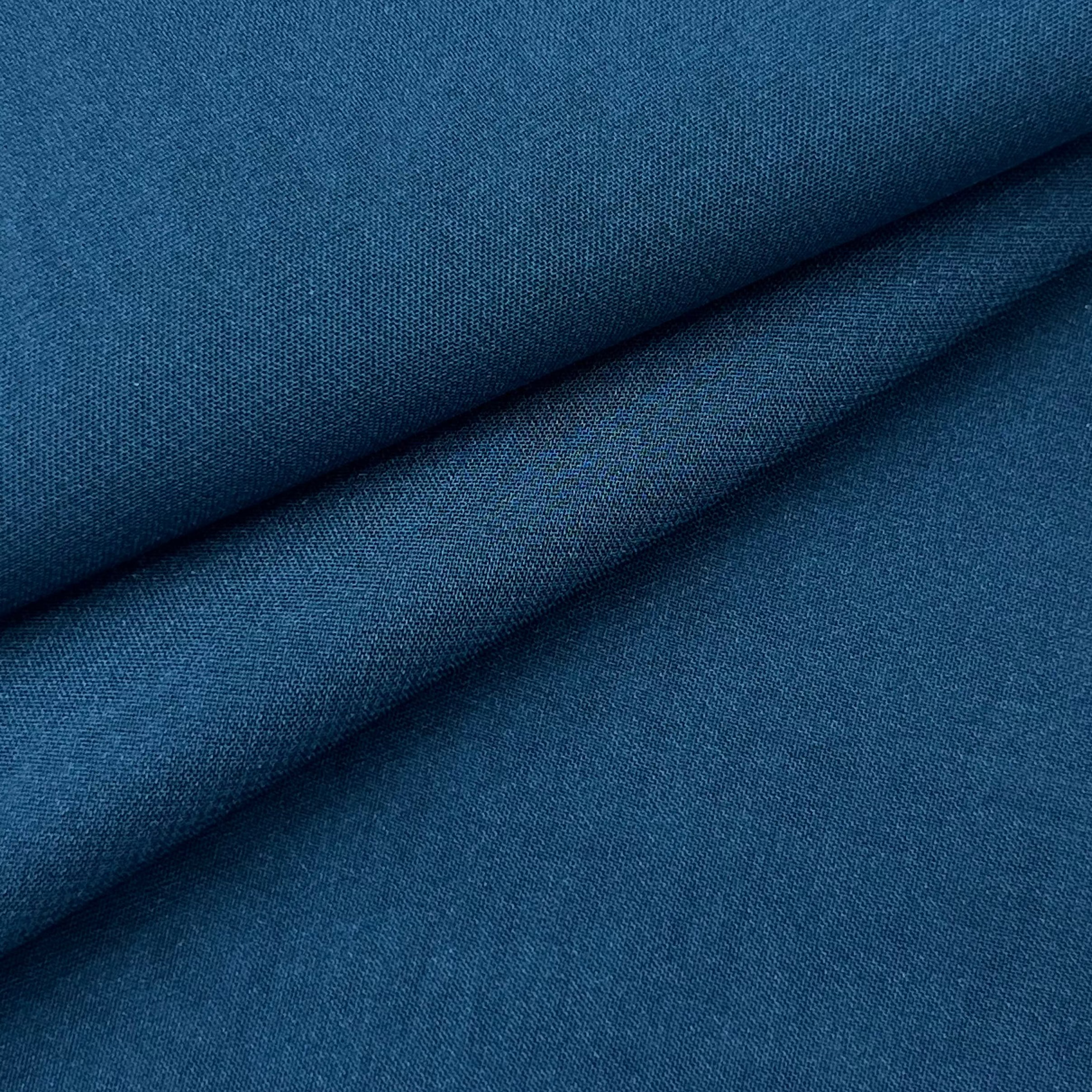 A close-up of deep blue ultra-thin polyester chiffon fabric with a soft matte texture.