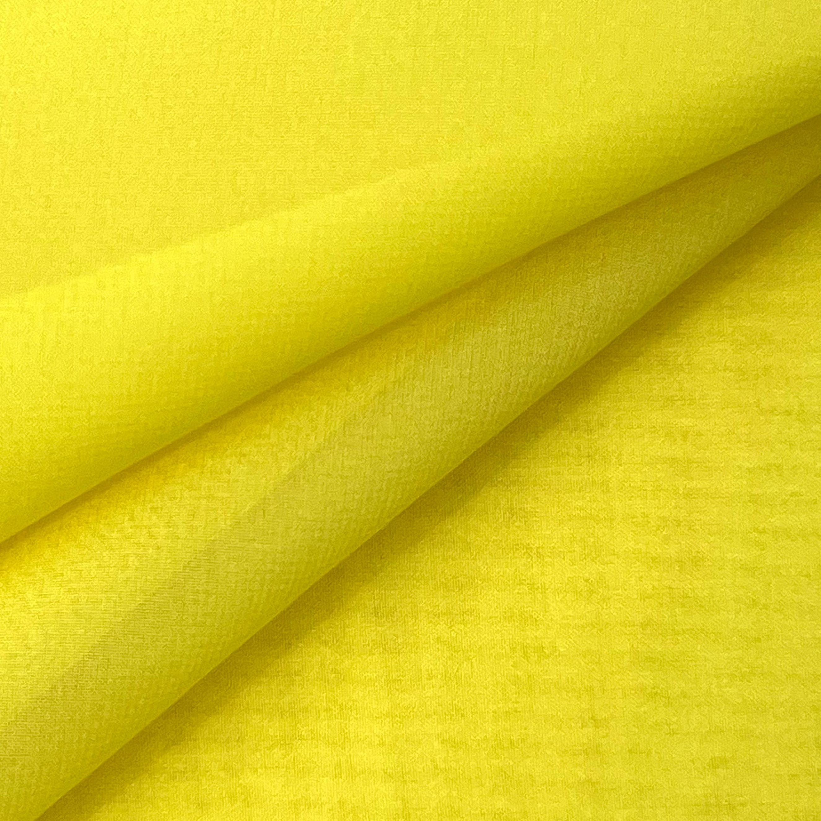A folded piece of bright yellow ultra-thin polyester chiffon fabric with a soft matte texture.