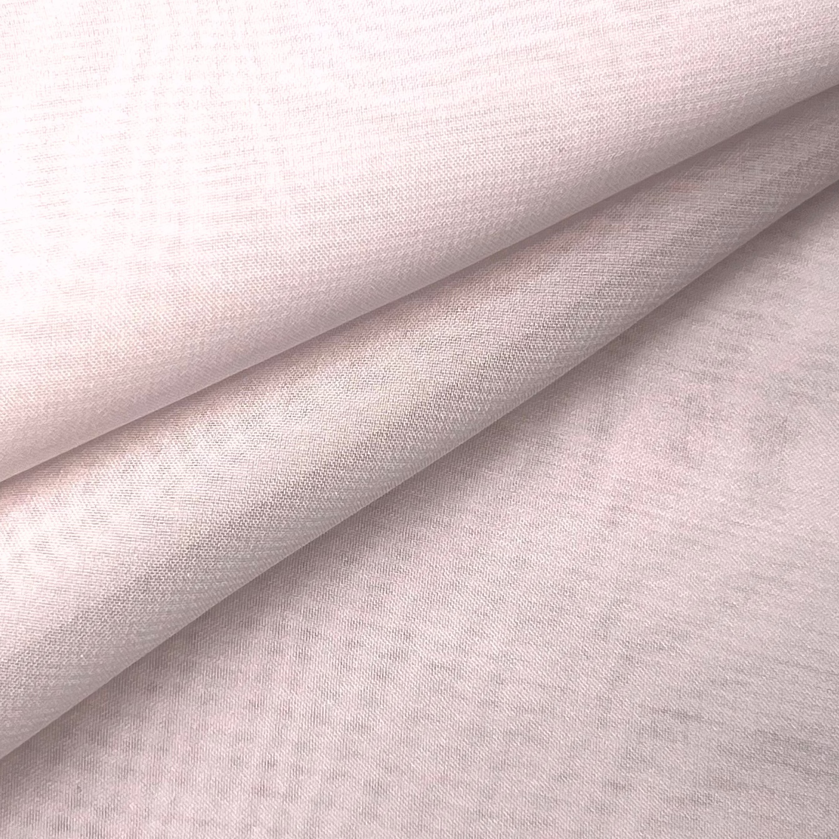 High quality ultra thin polyester chiffon fabric in a soft pale pink with a delicate matte texture.