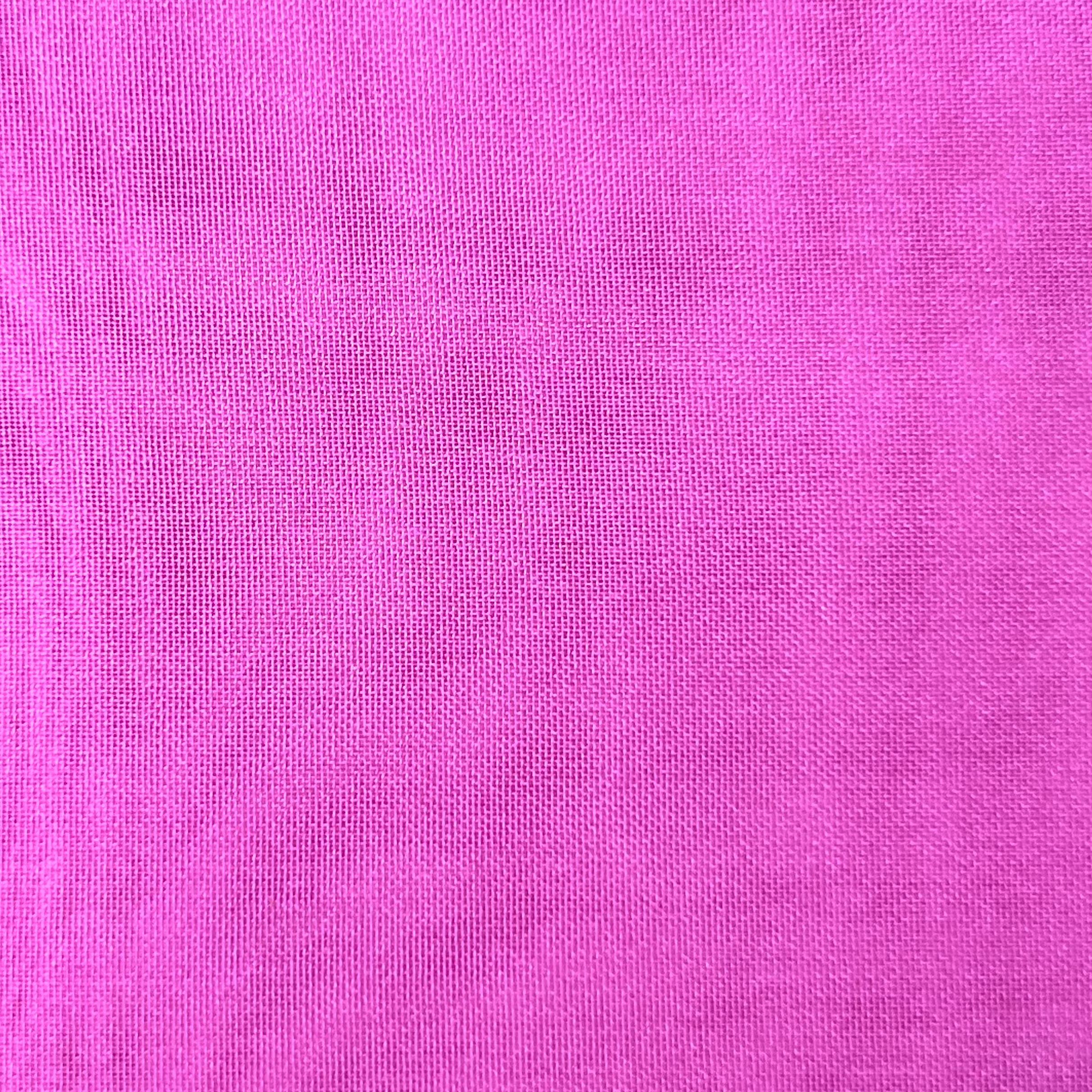 Close-up of high-quality ultra-thin polyester chiffon fabric in a vibrant pink color.