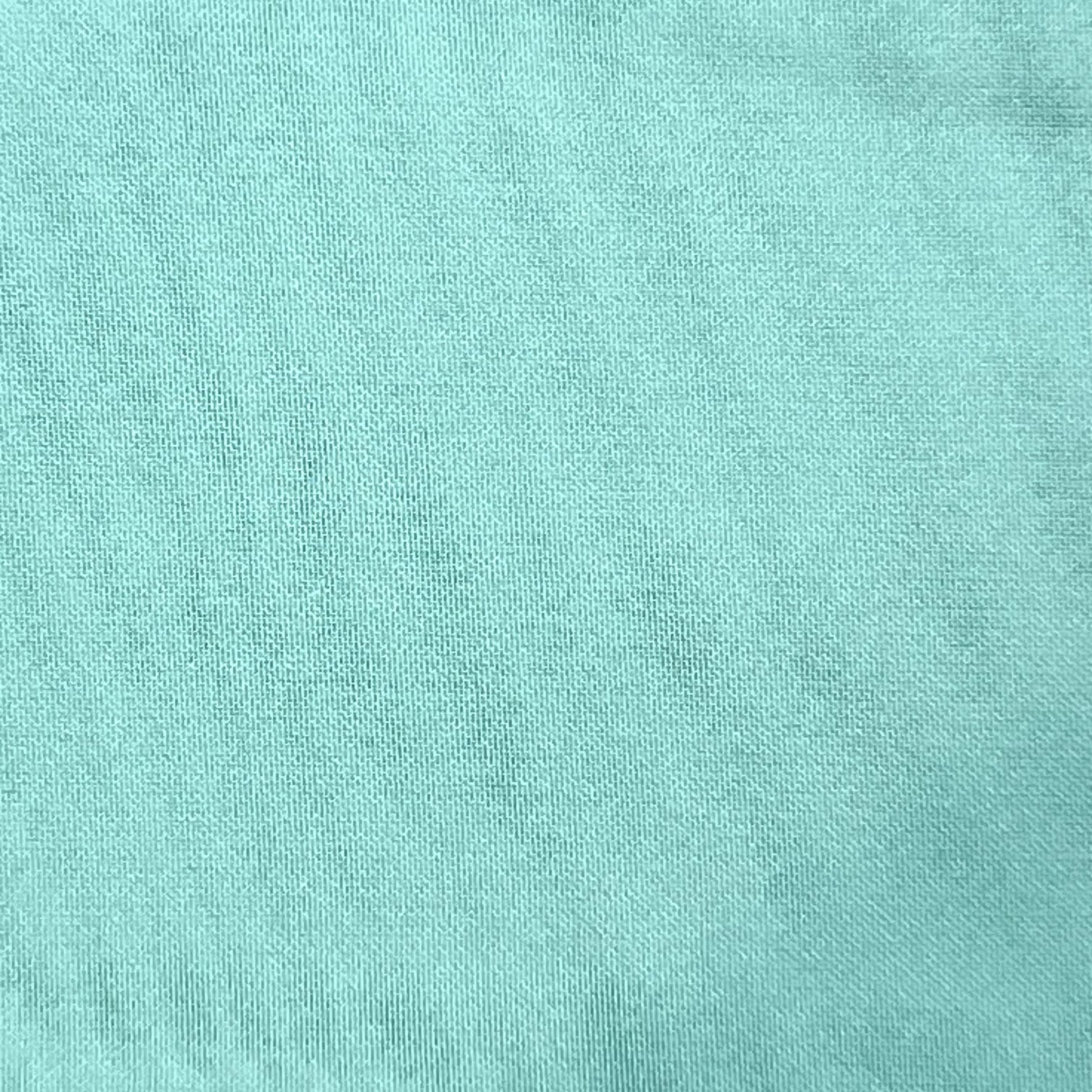 A close-up view of light turquoise ultra-thin polyester chiffon fabric with a fine, matte texture.