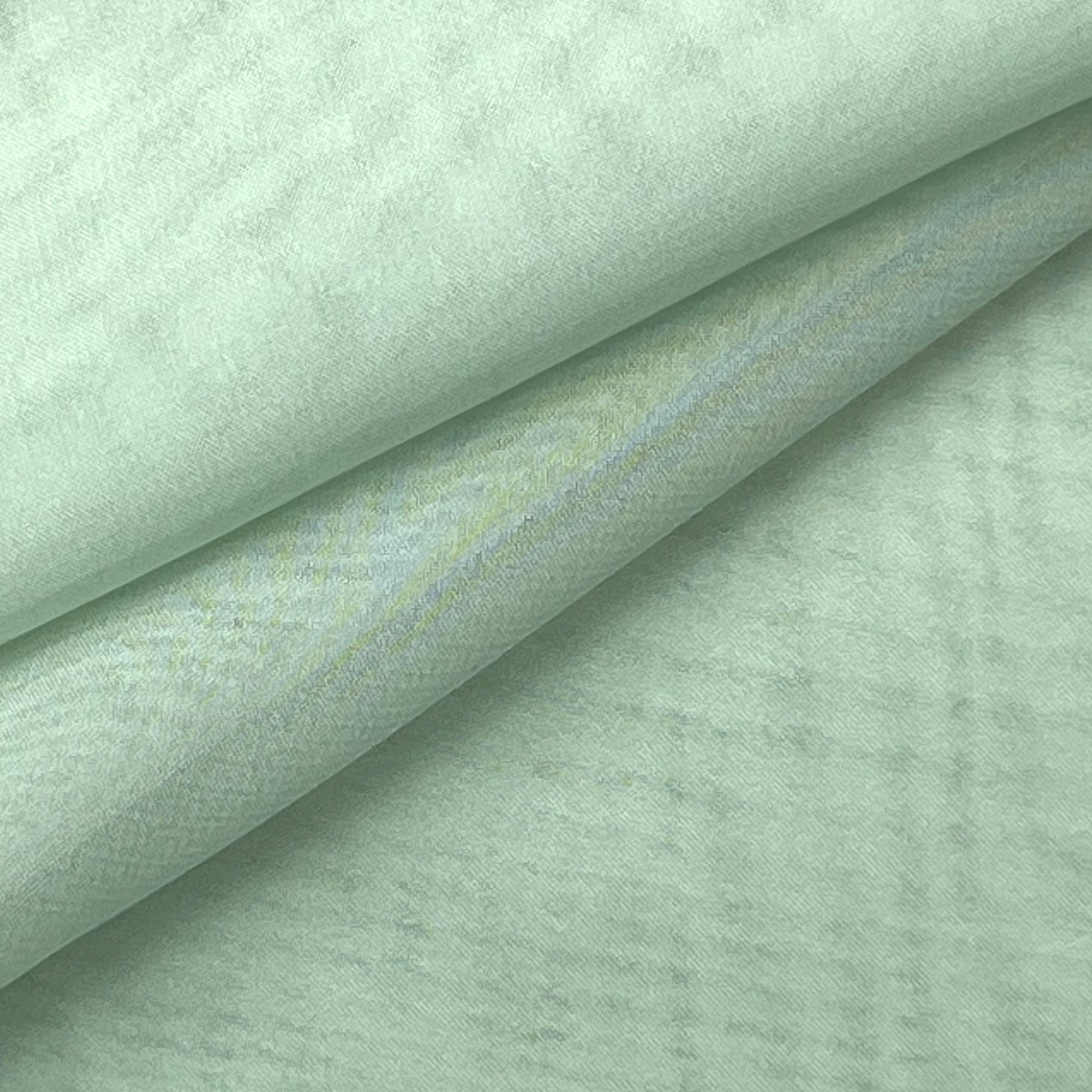 A folded piece of light mint green ultra-thin polyester chiffon fabric with a soft matte texture.