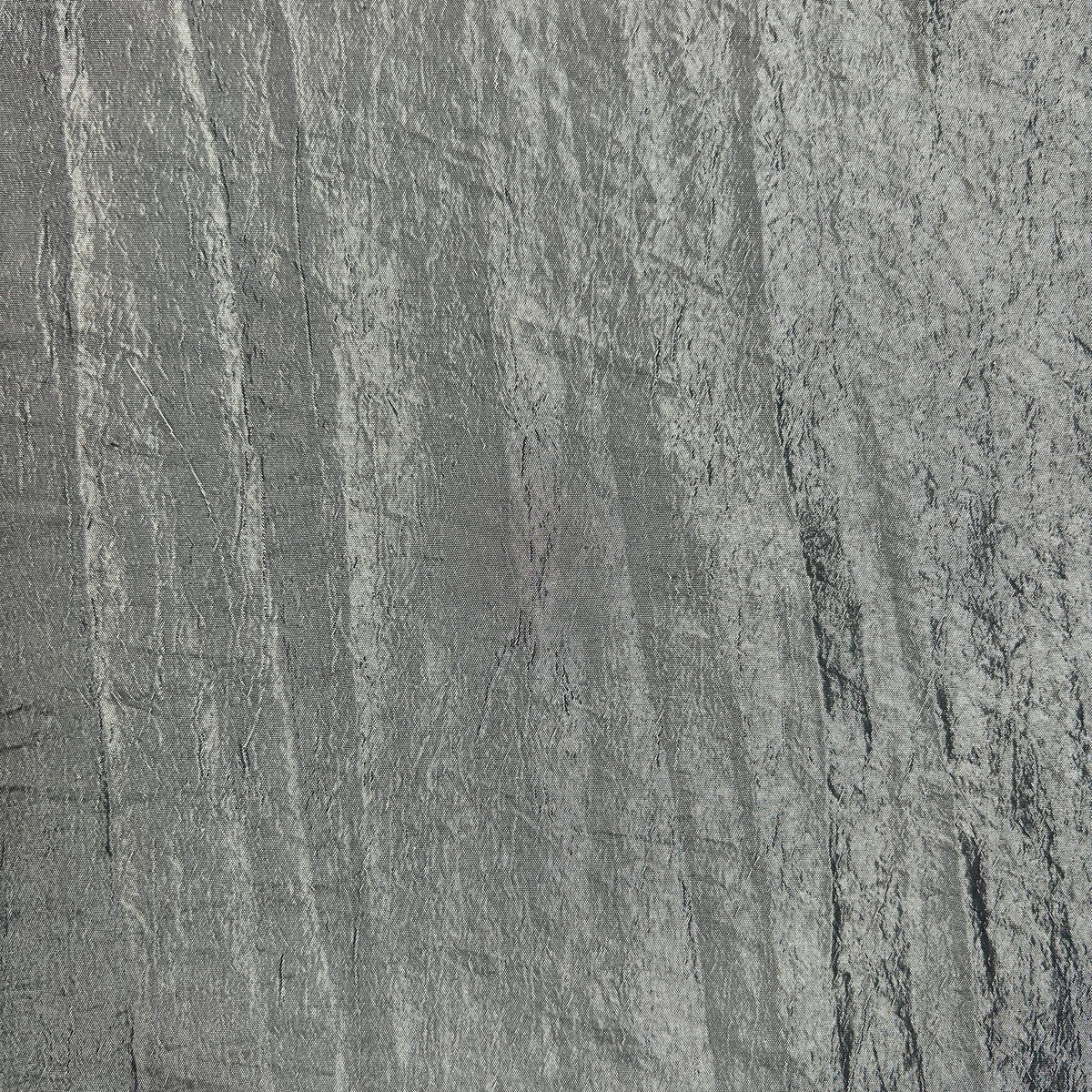 A close-up of a textured gray material with a distressed, brushed finish and subtle vertical striations.