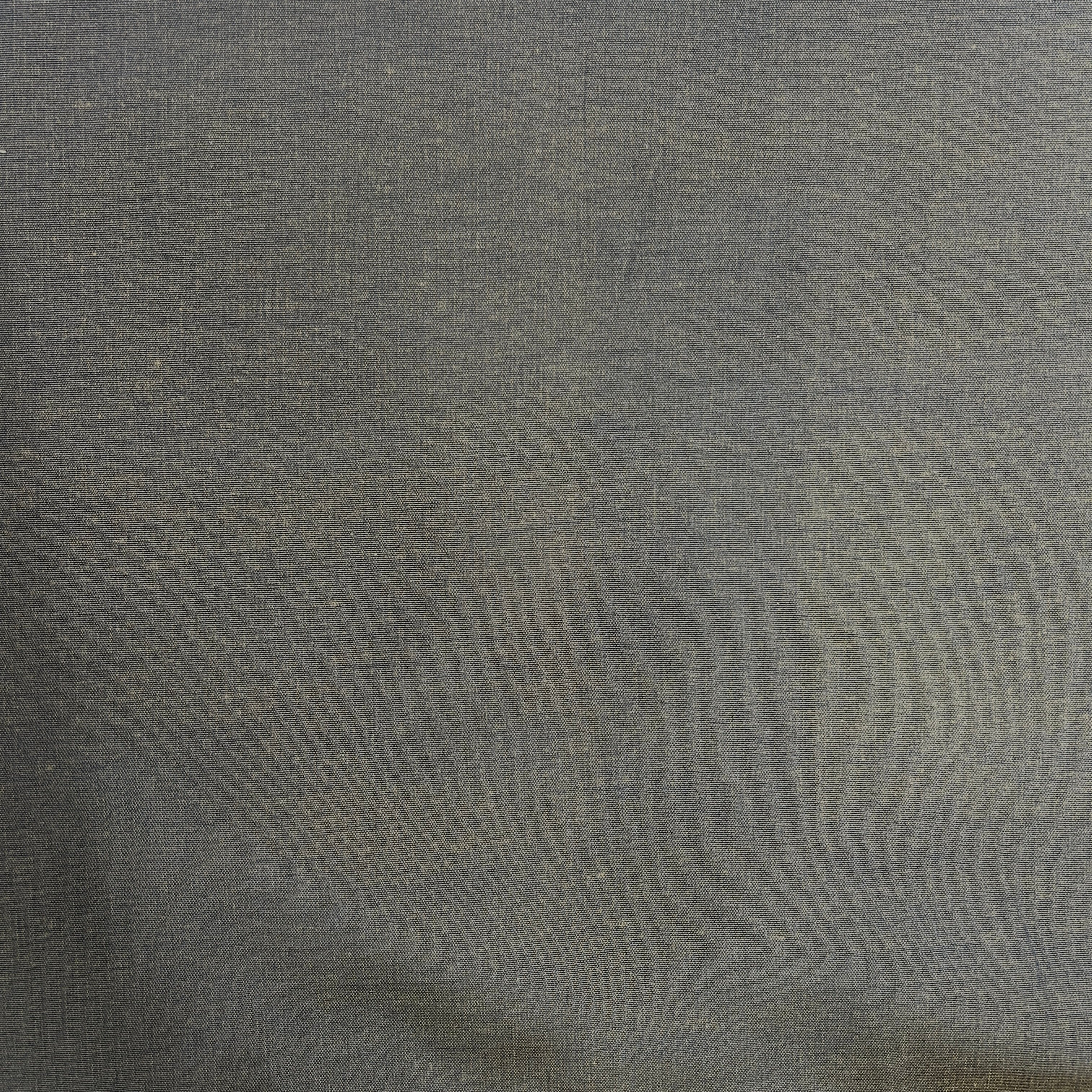 A close-up of a textured fabric with a fine woven pattern in a dark gray color.