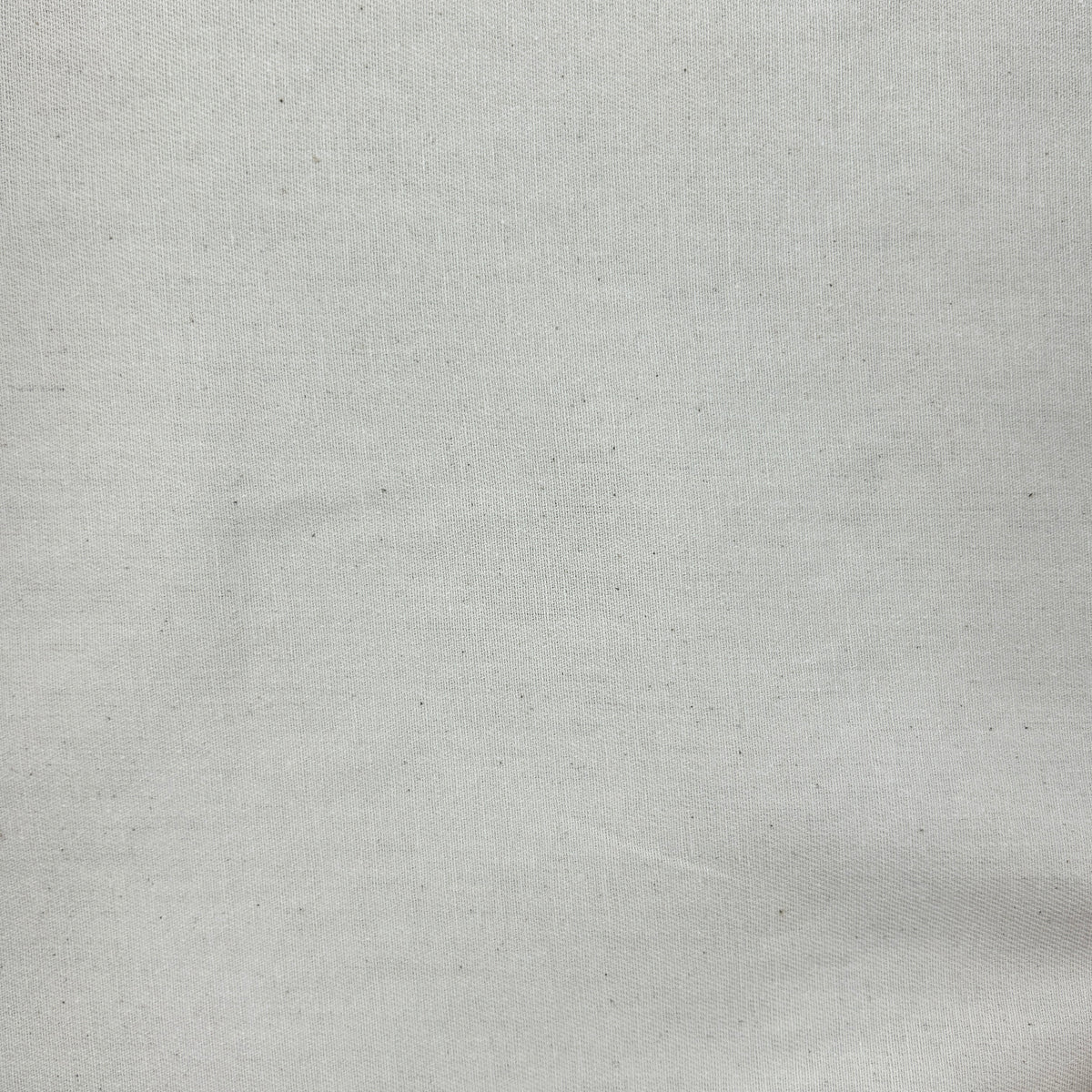 A close-up of a light gray woven fabric texture with subtle speckles and a fine linen-like weave.