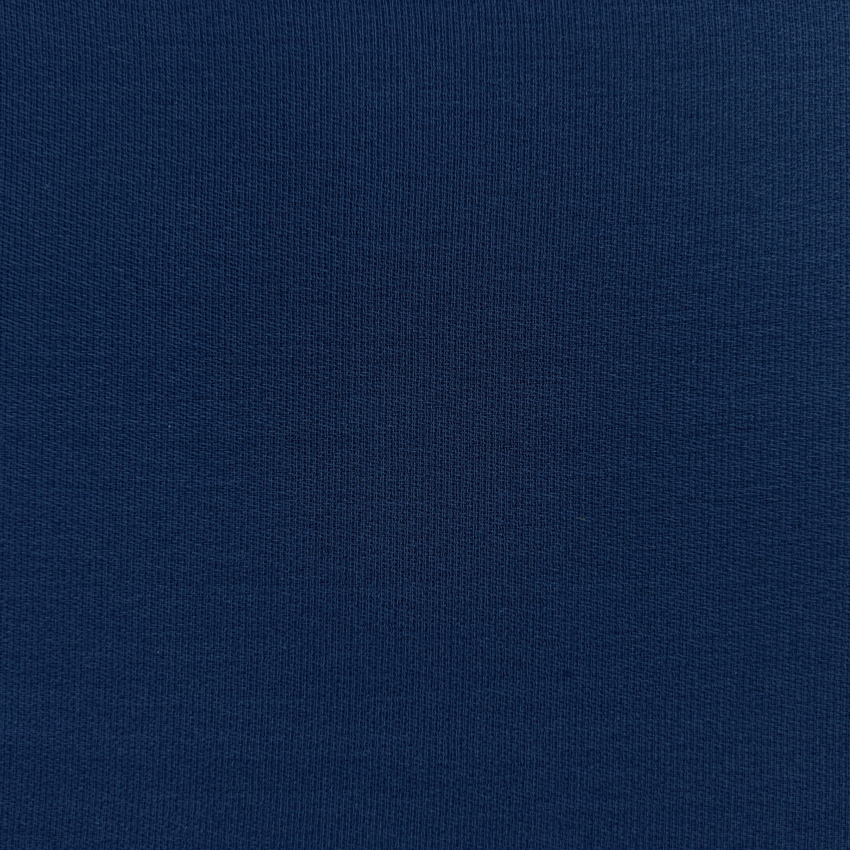 A close-up of dark navy blue knit fabric texture.