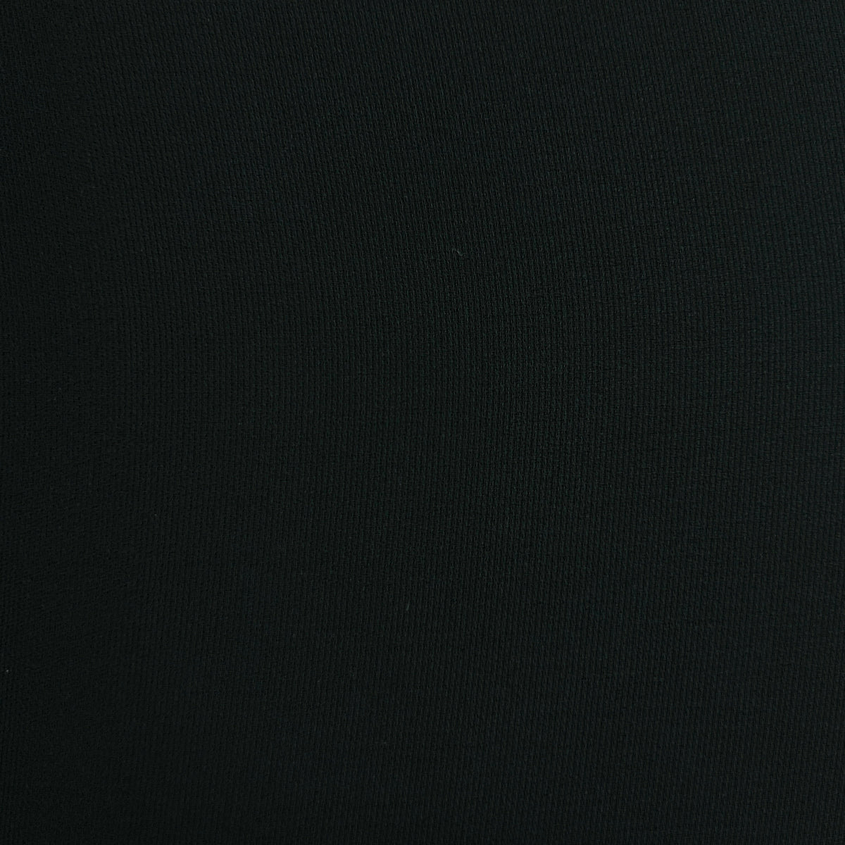 A close-up of a solid black ribbed fabric texture.