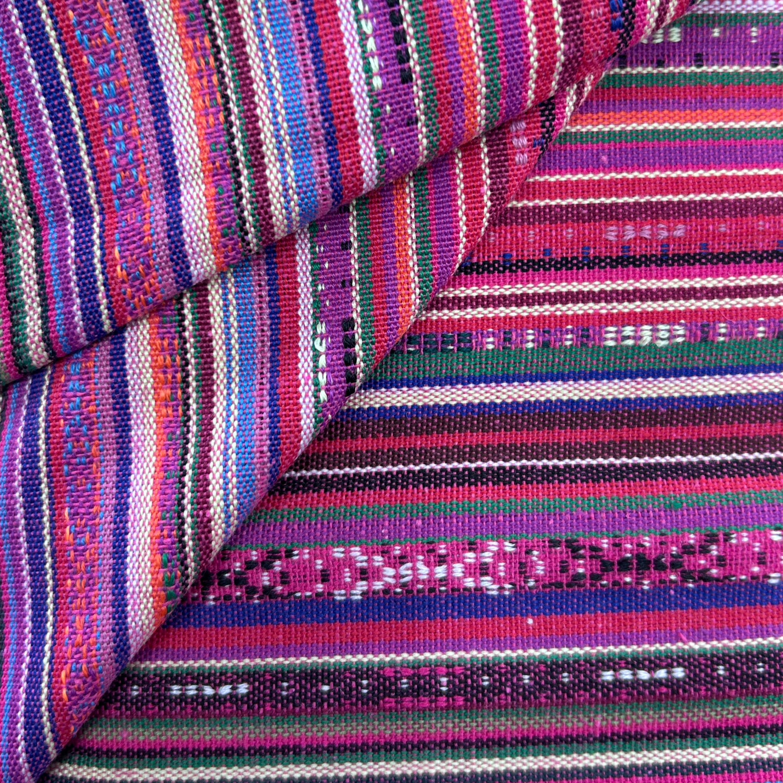 close up folded fabric in pink