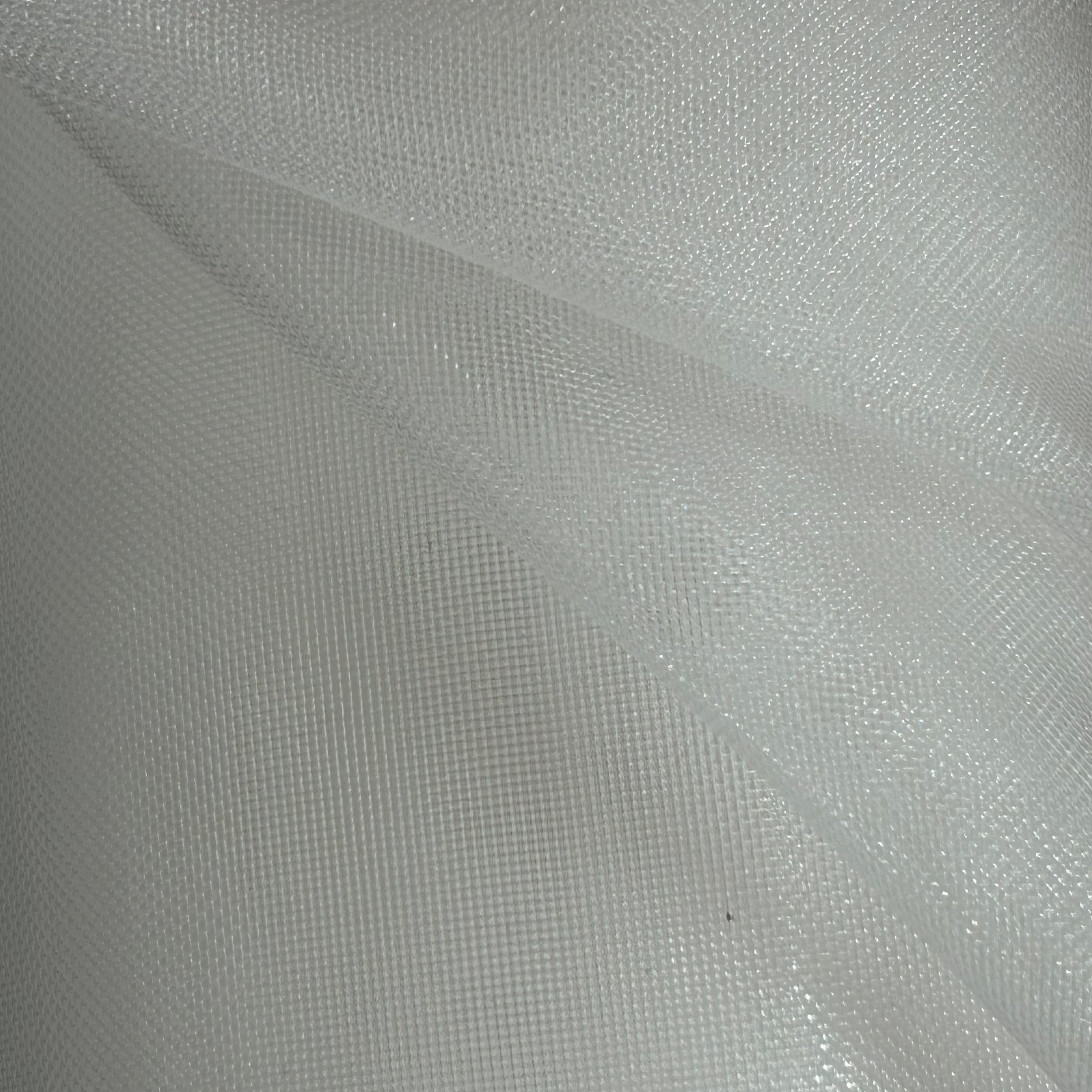 Close-up of white fabric with a subtle pattern