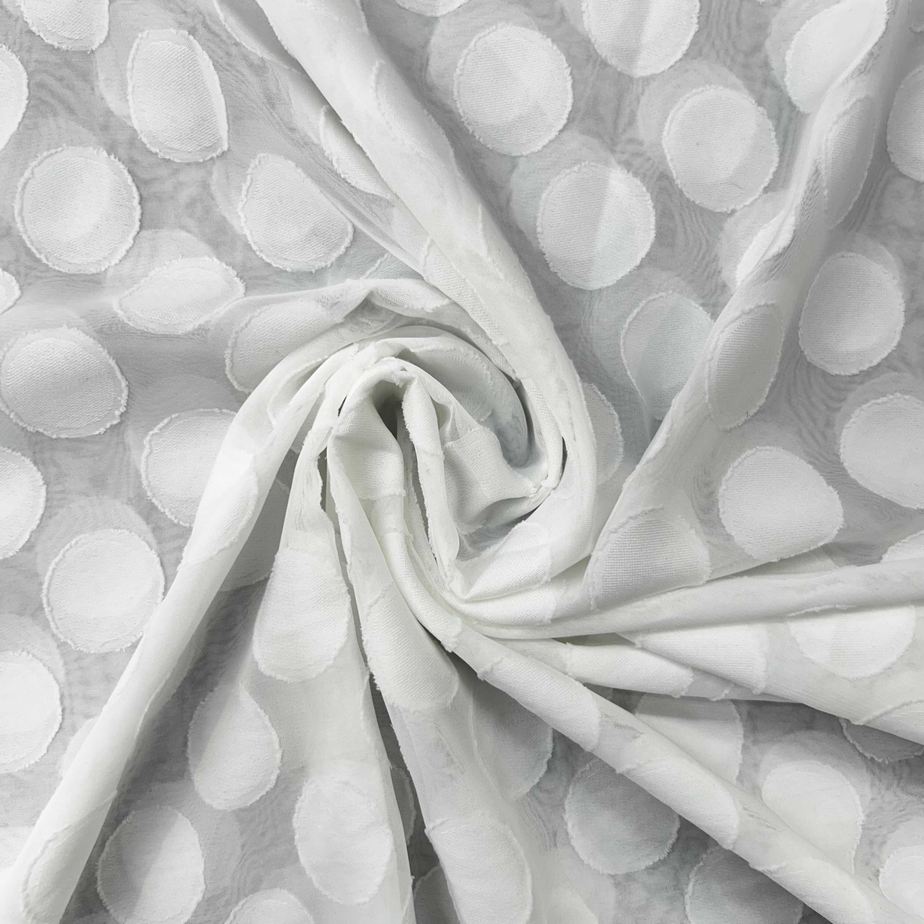 Gray fabric with white polka dots, rolled up